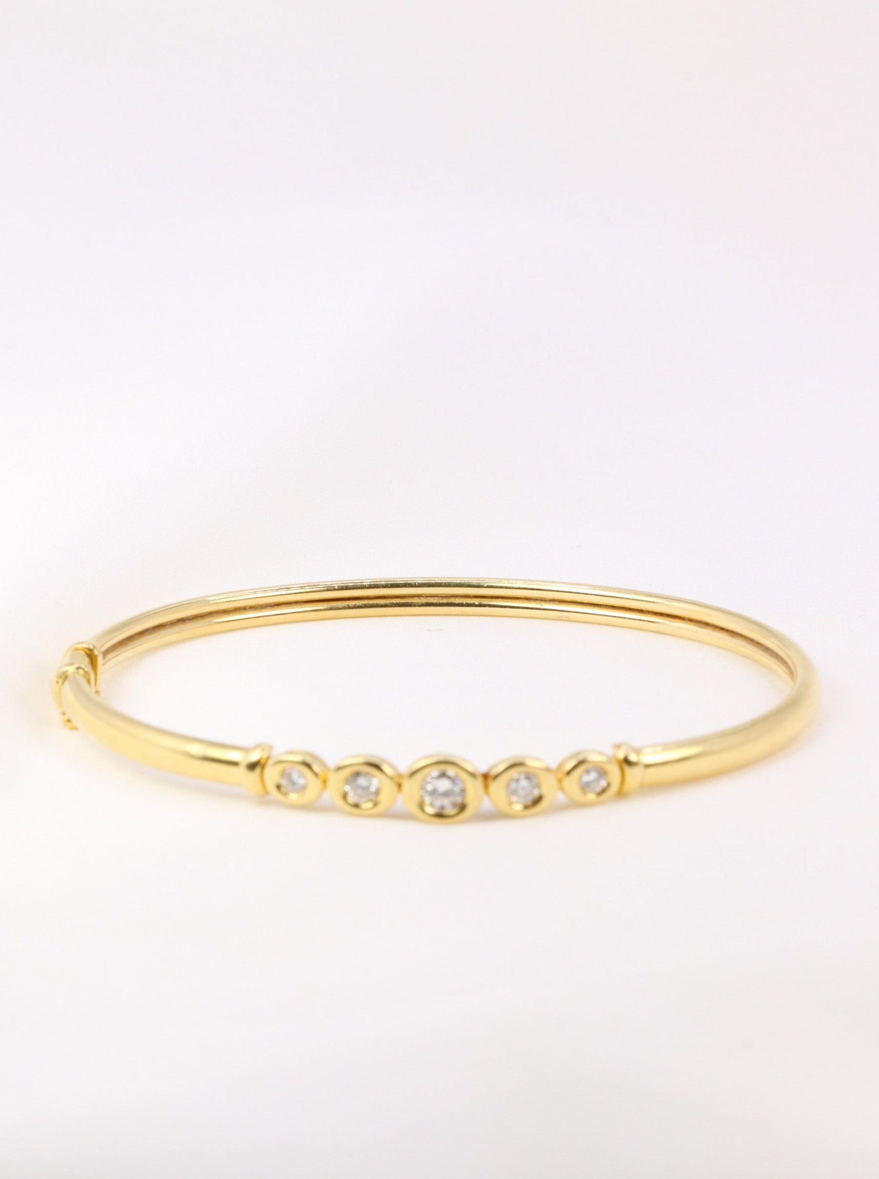 Bracelet jonc vintage en or souple et diamants