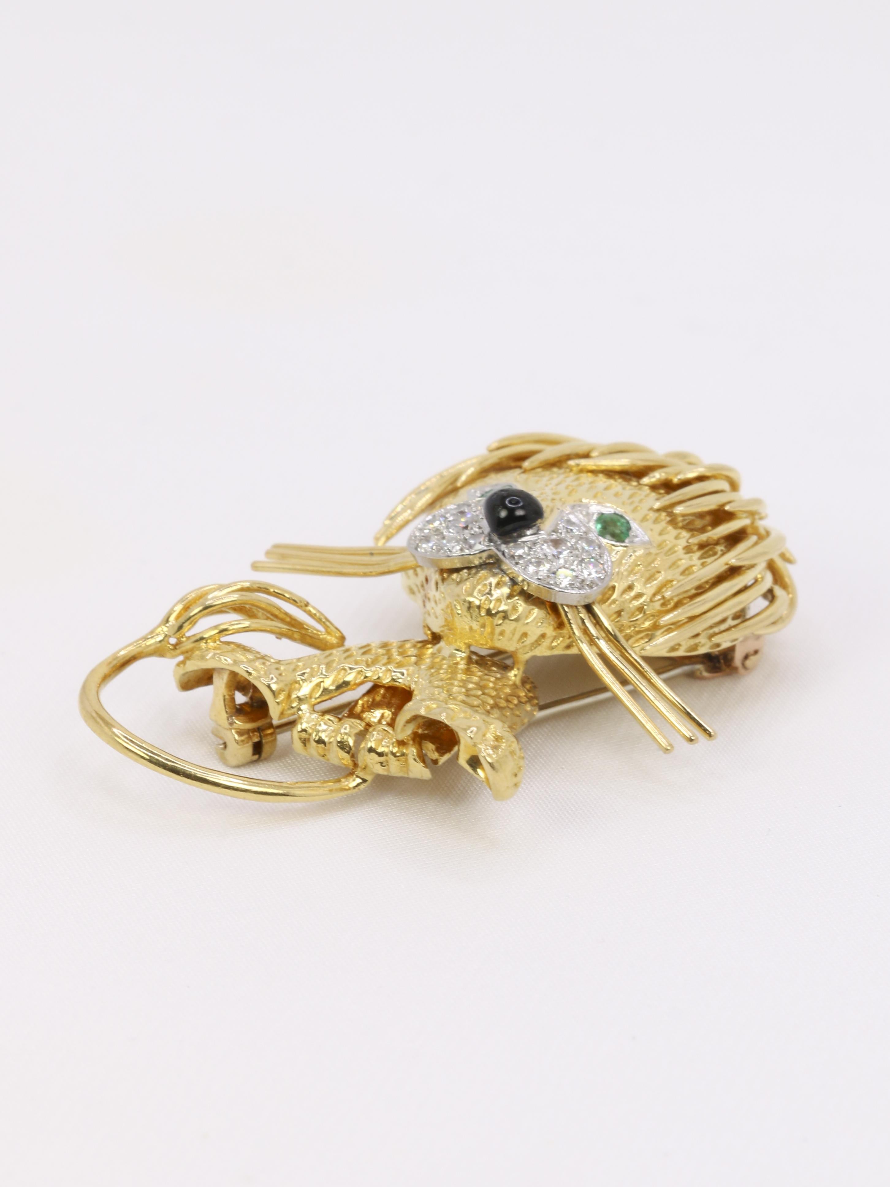 VAN CLEEF & ARPELS Broche Lion ébouriffé or diamants émeraudes