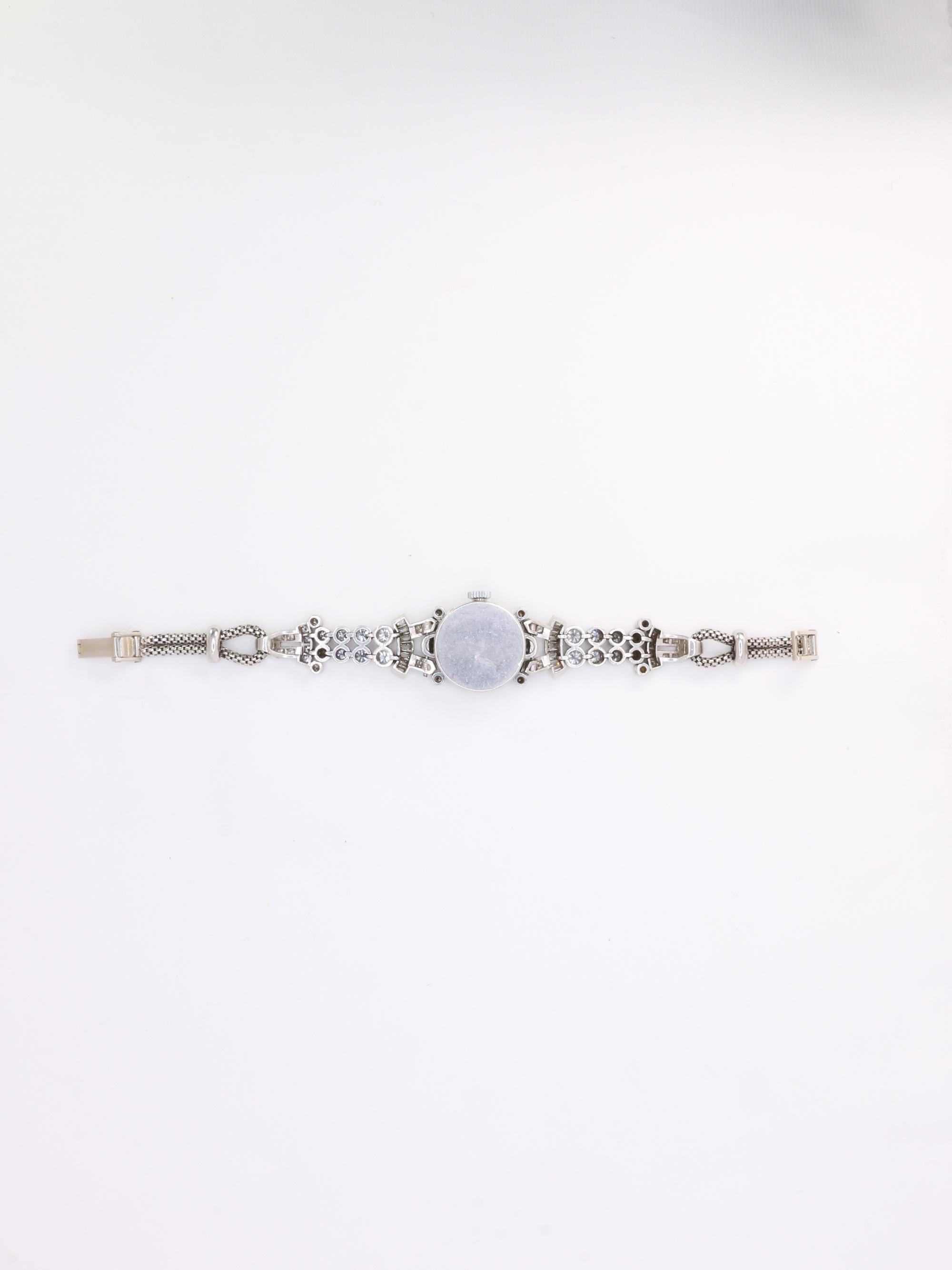 Montre Art Deco or blanc platine diamants