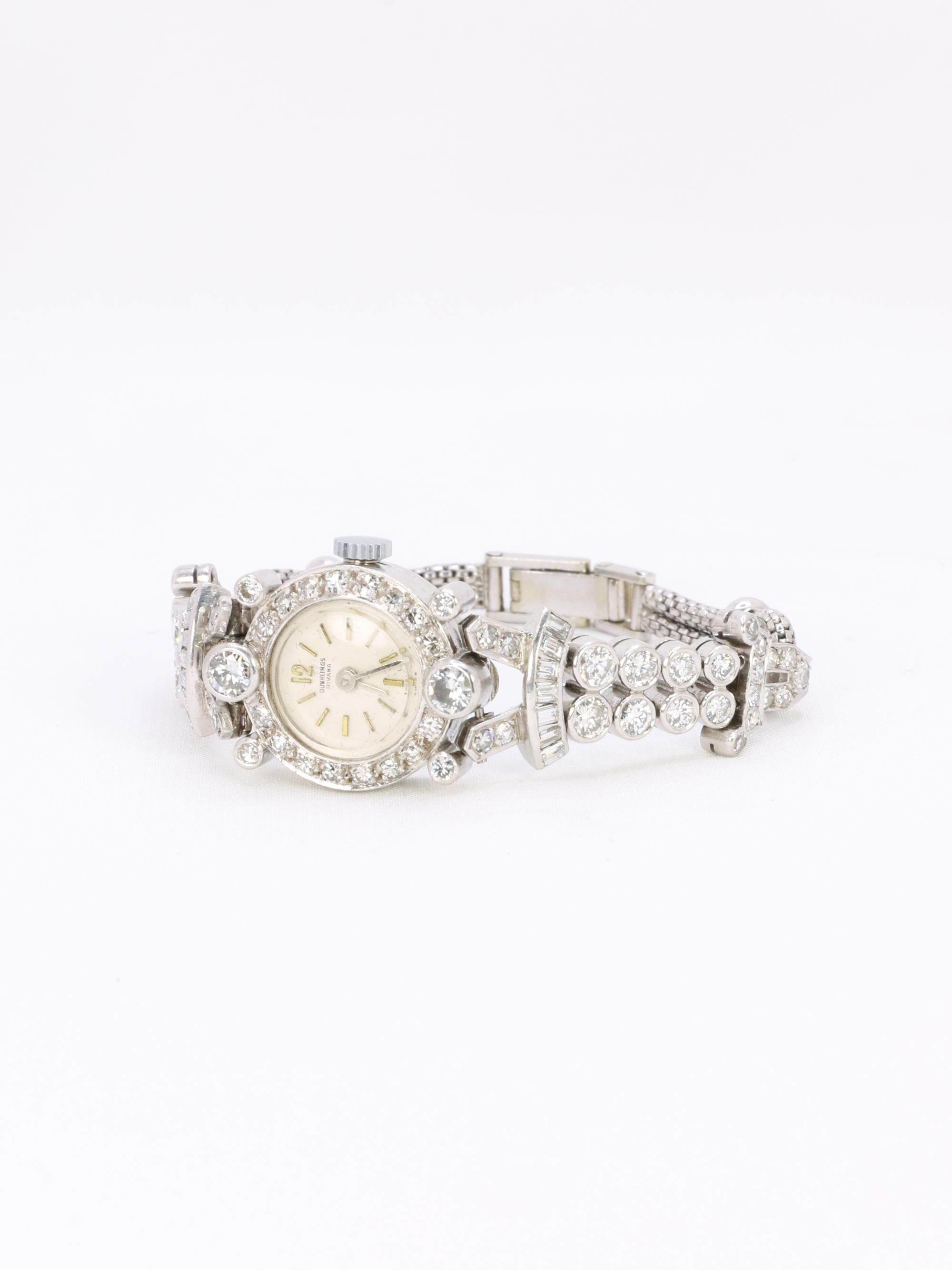 Montre Art Deco or blanc platine diamants