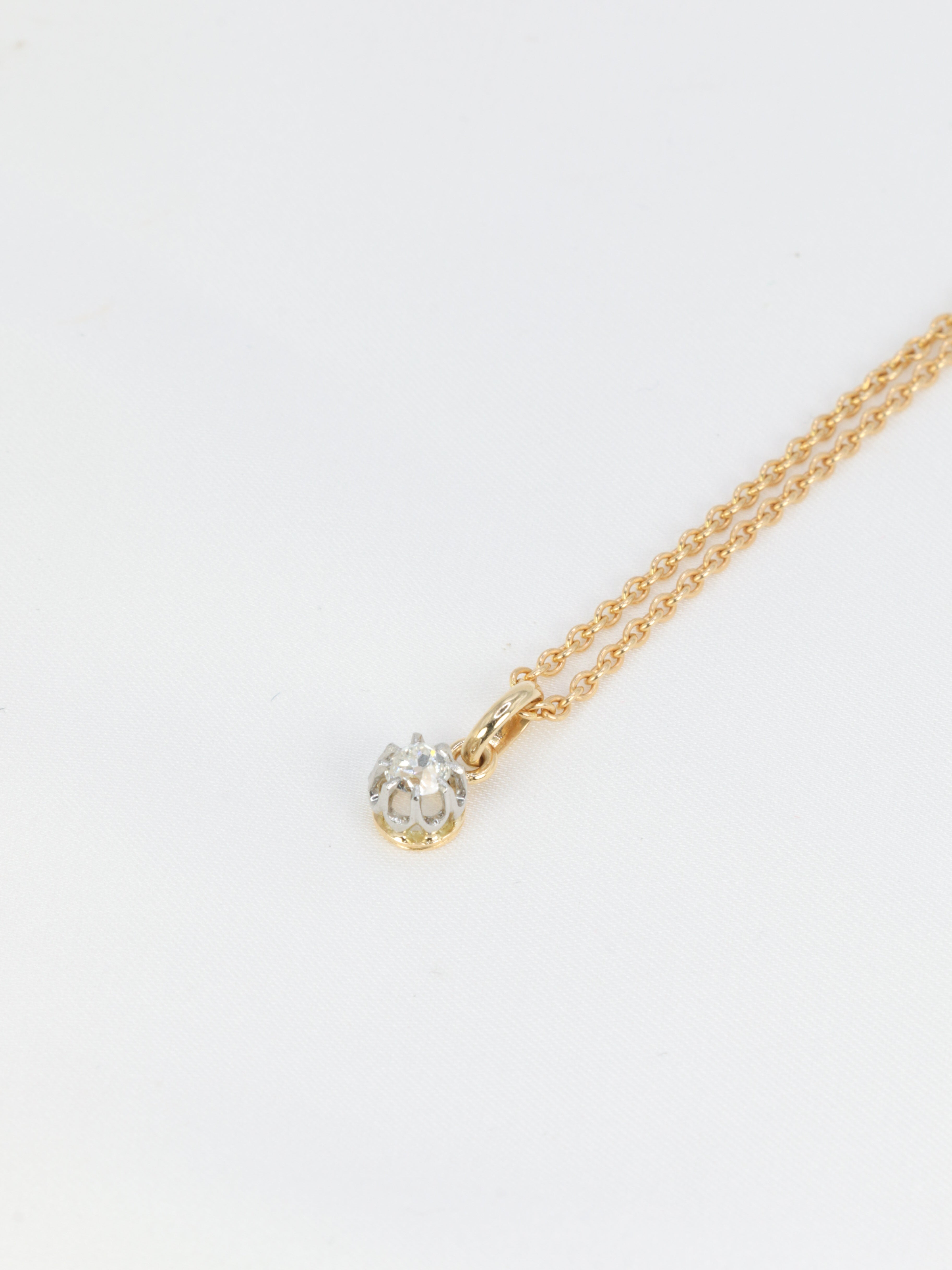Pendentif solitaire ancien en or, argent et diamant taille ancienne 0.2 ct