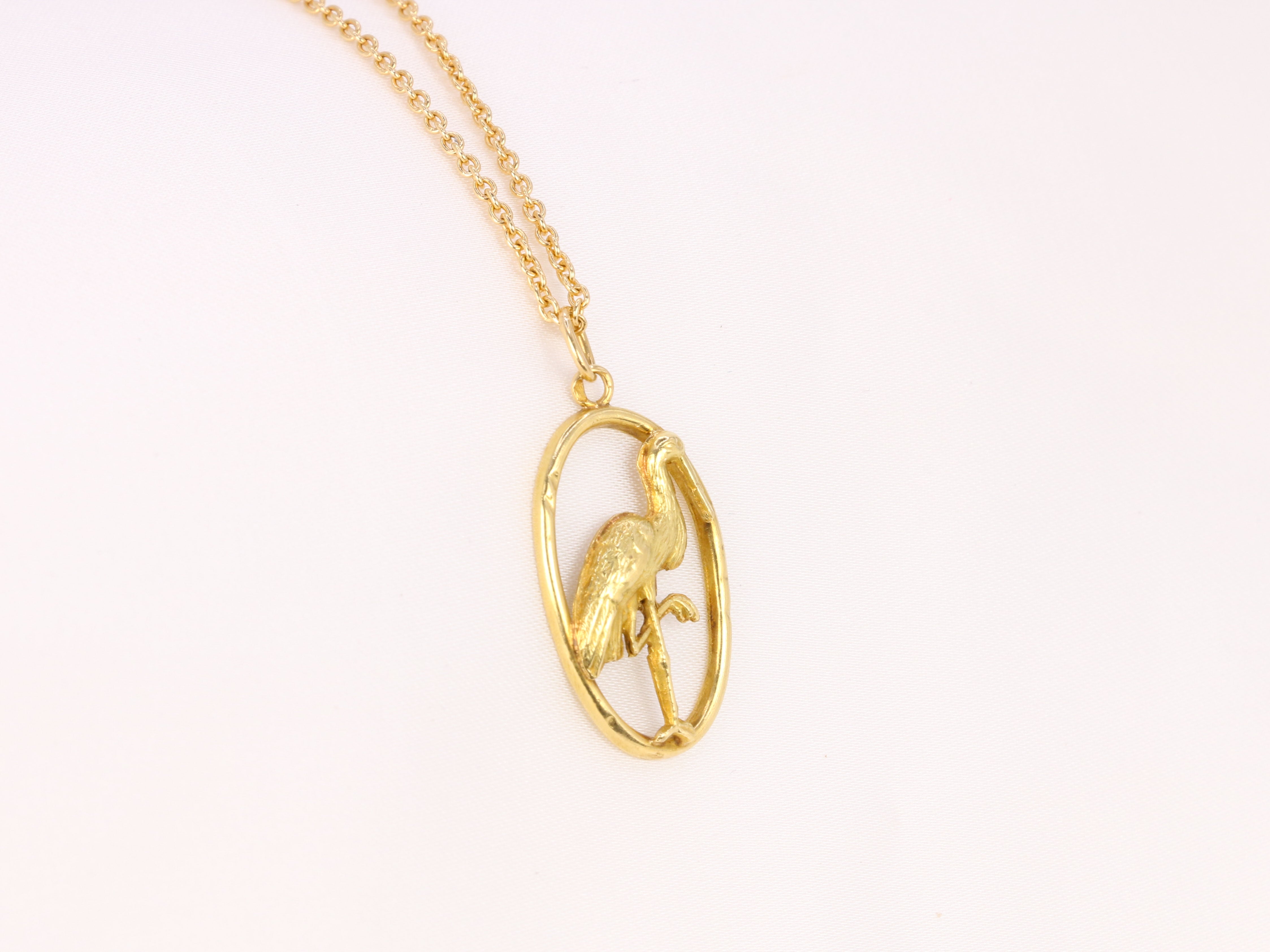 Yellow gold pendant depicting a stork