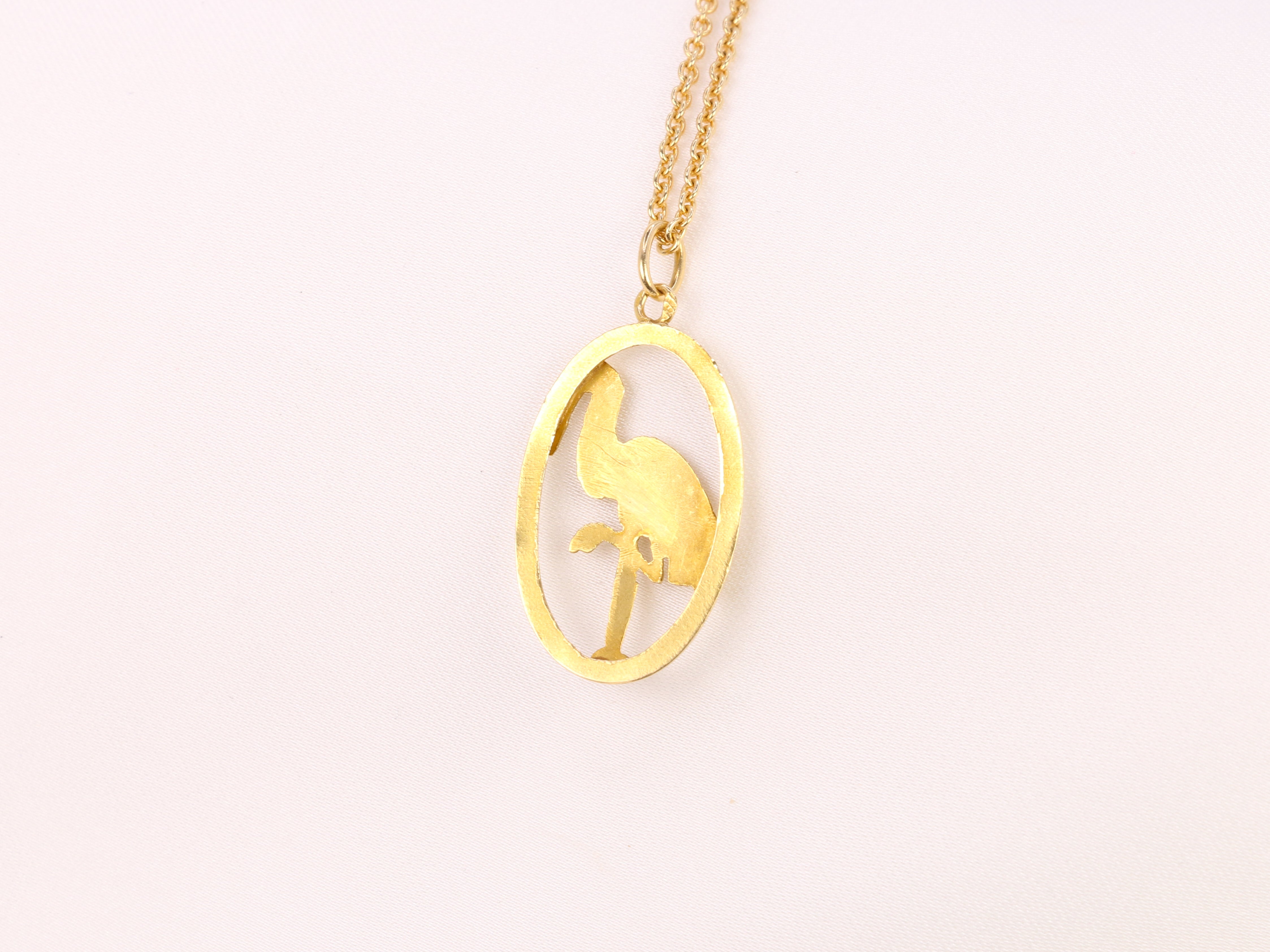 Yellow gold pendant depicting a stork