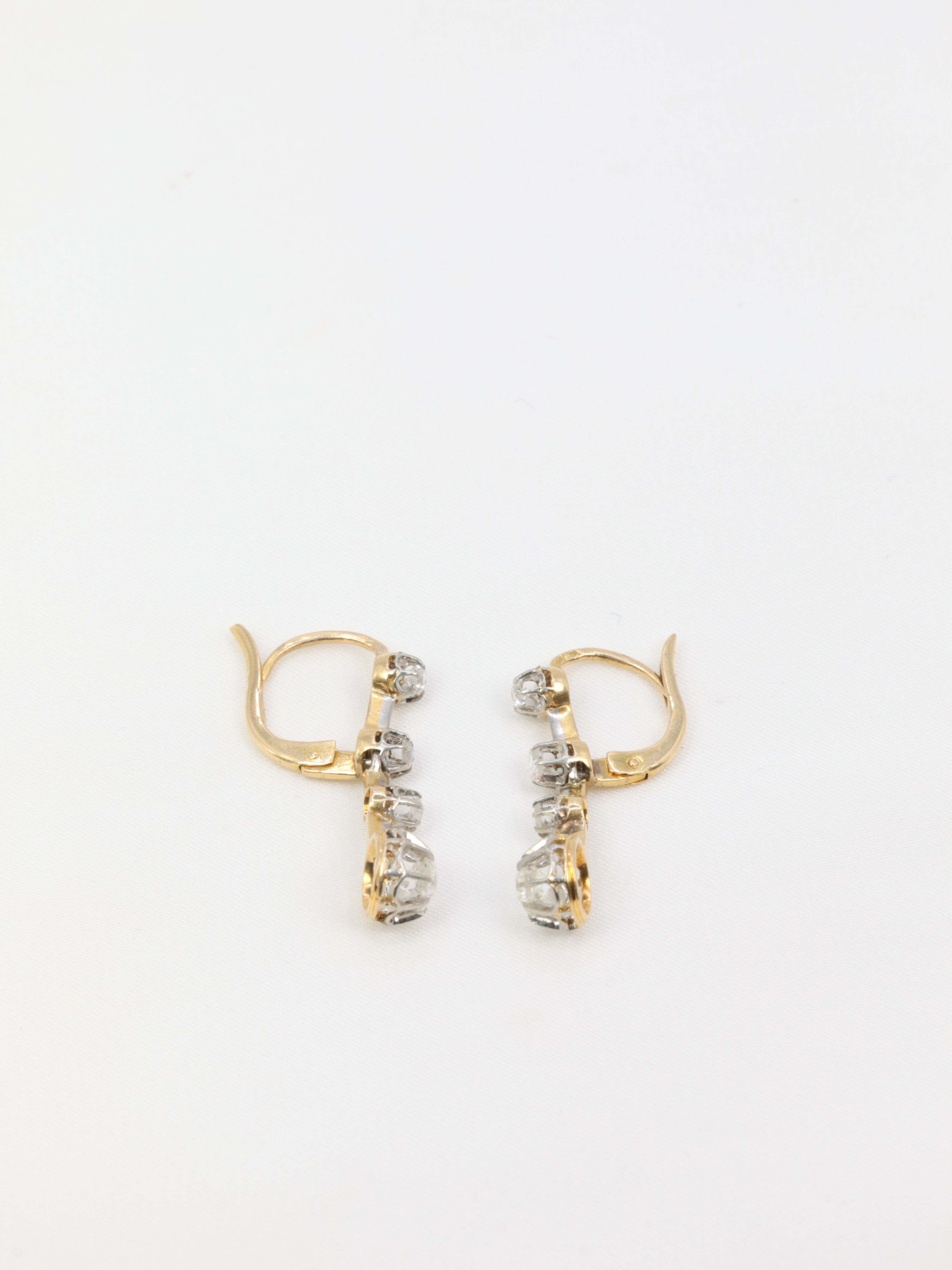 Antique sleeper earrings in gold, silver and old cut diamonds