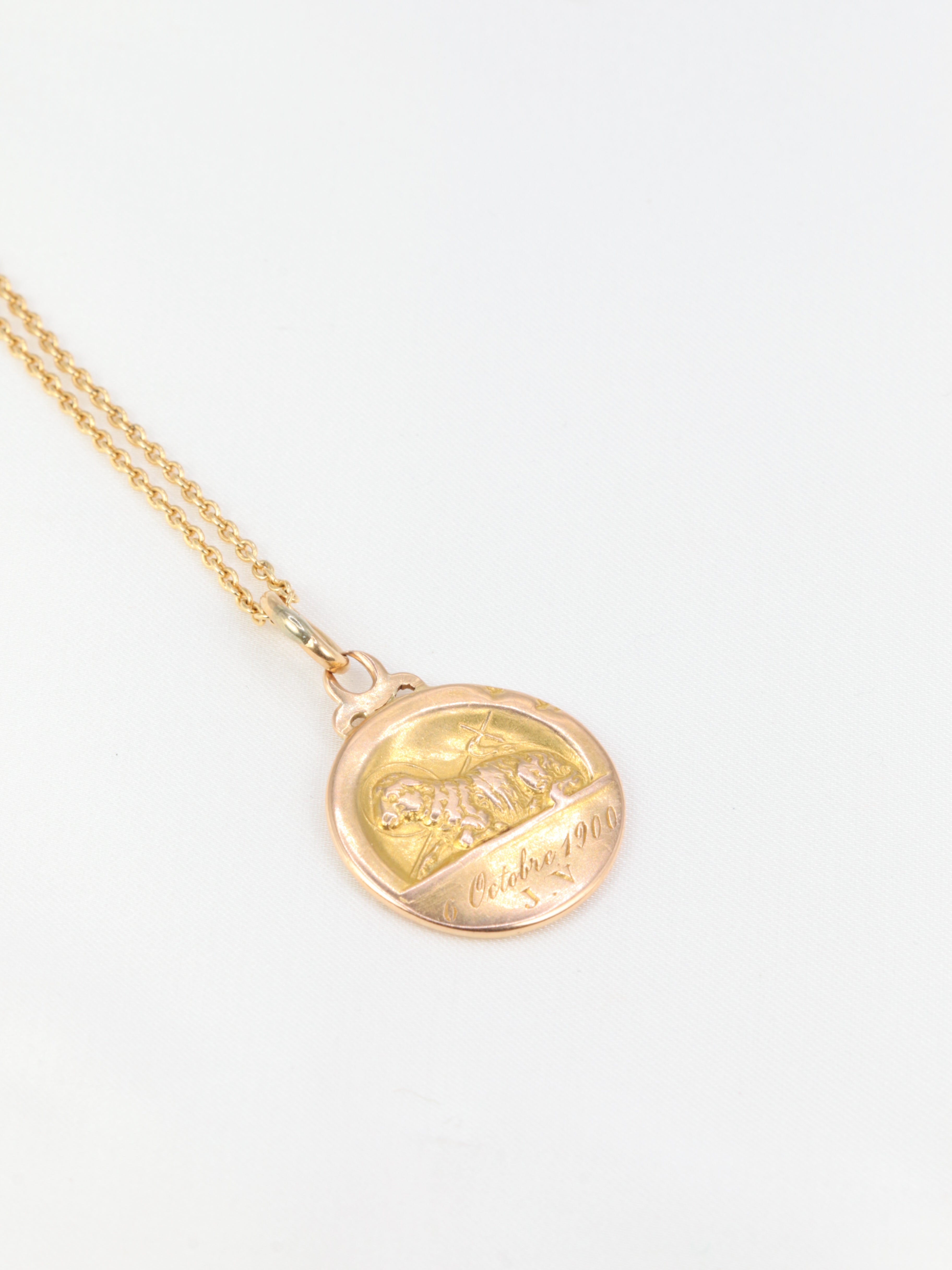 Art Nouveau medal depicting Saint John and the lamb in yellow gold