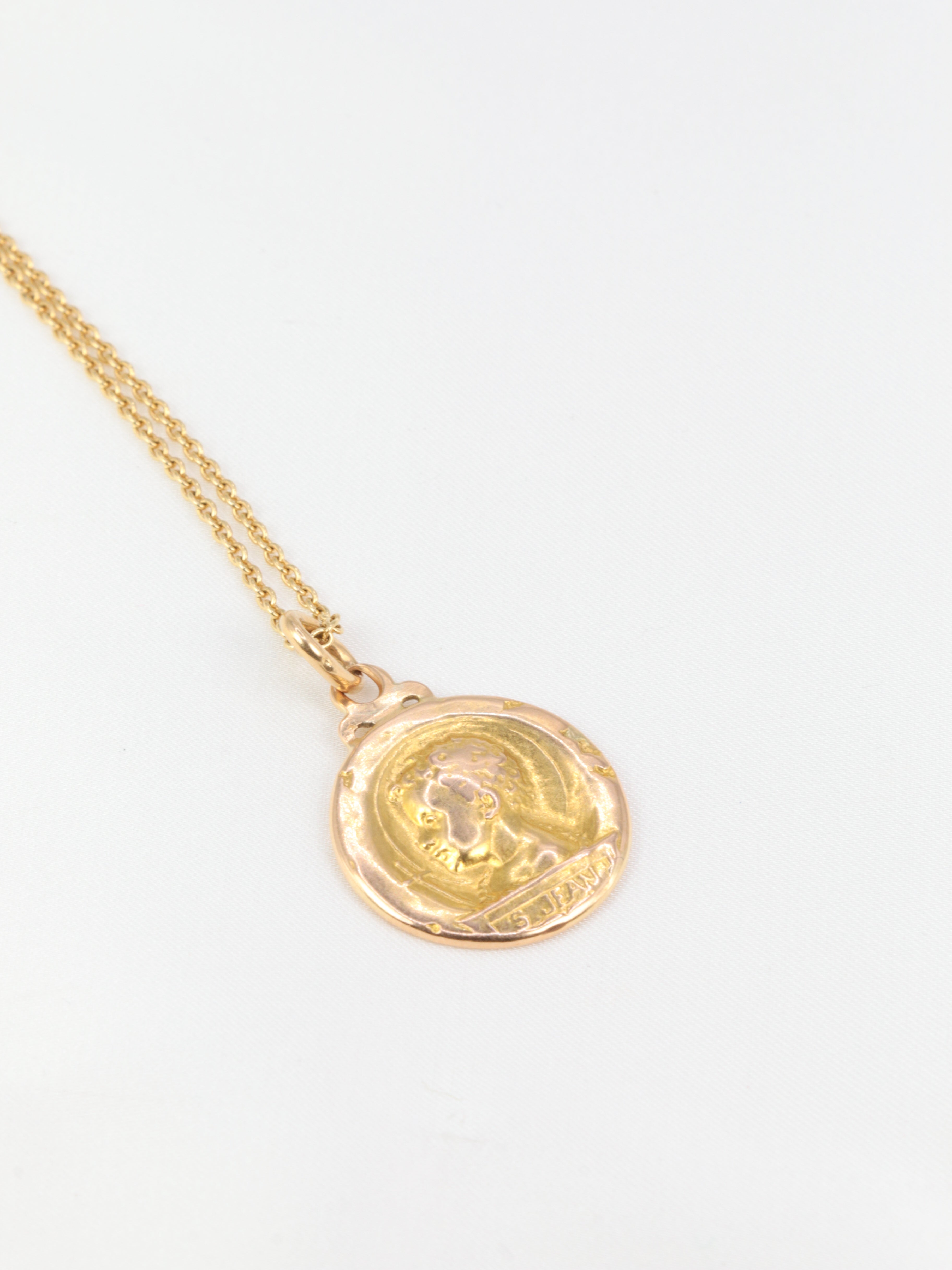 Art Nouveau medal depicting Saint John and the lamb in yellow gold