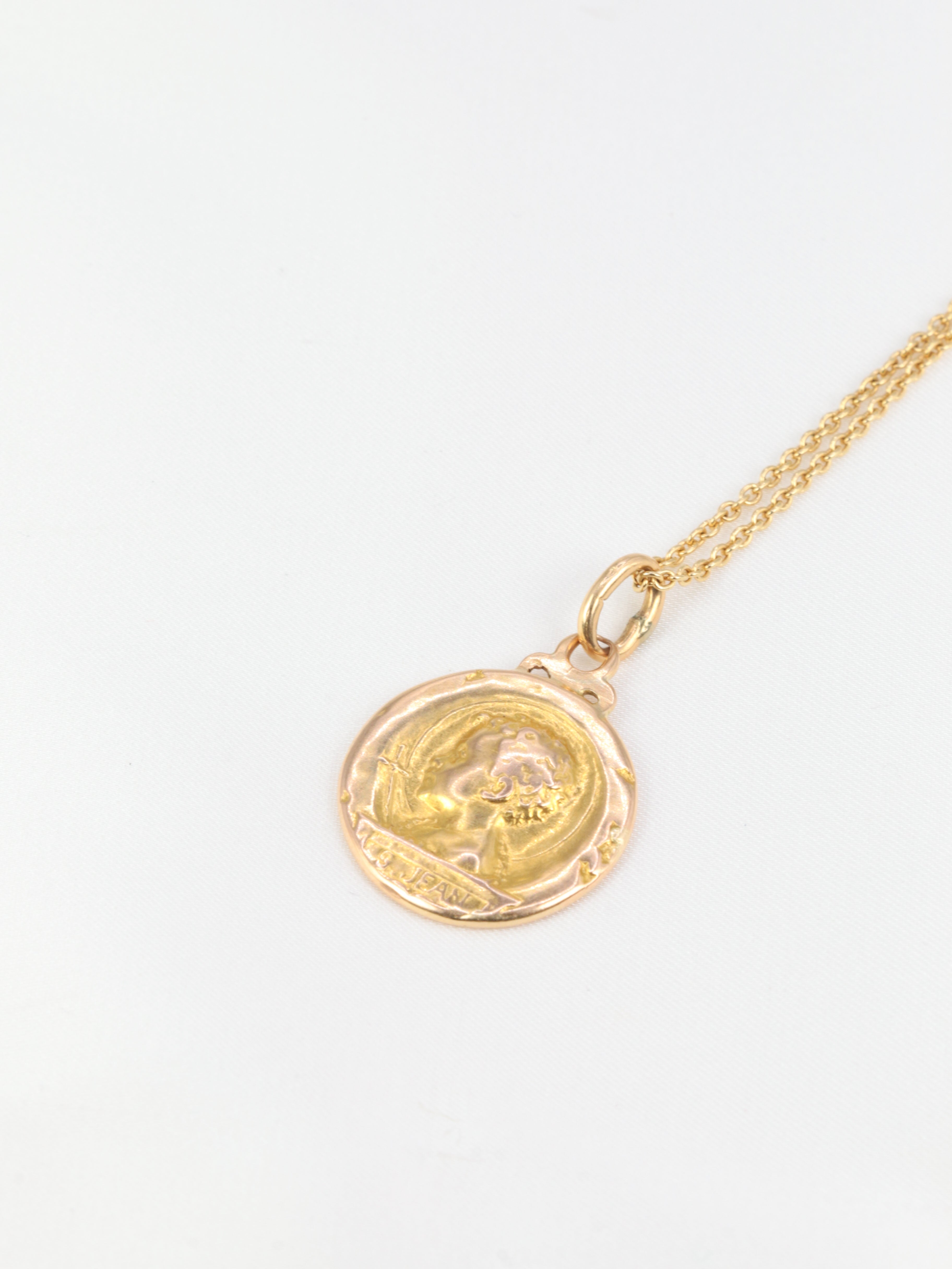 Art Nouveau medal depicting Saint John and the lamb in yellow gold