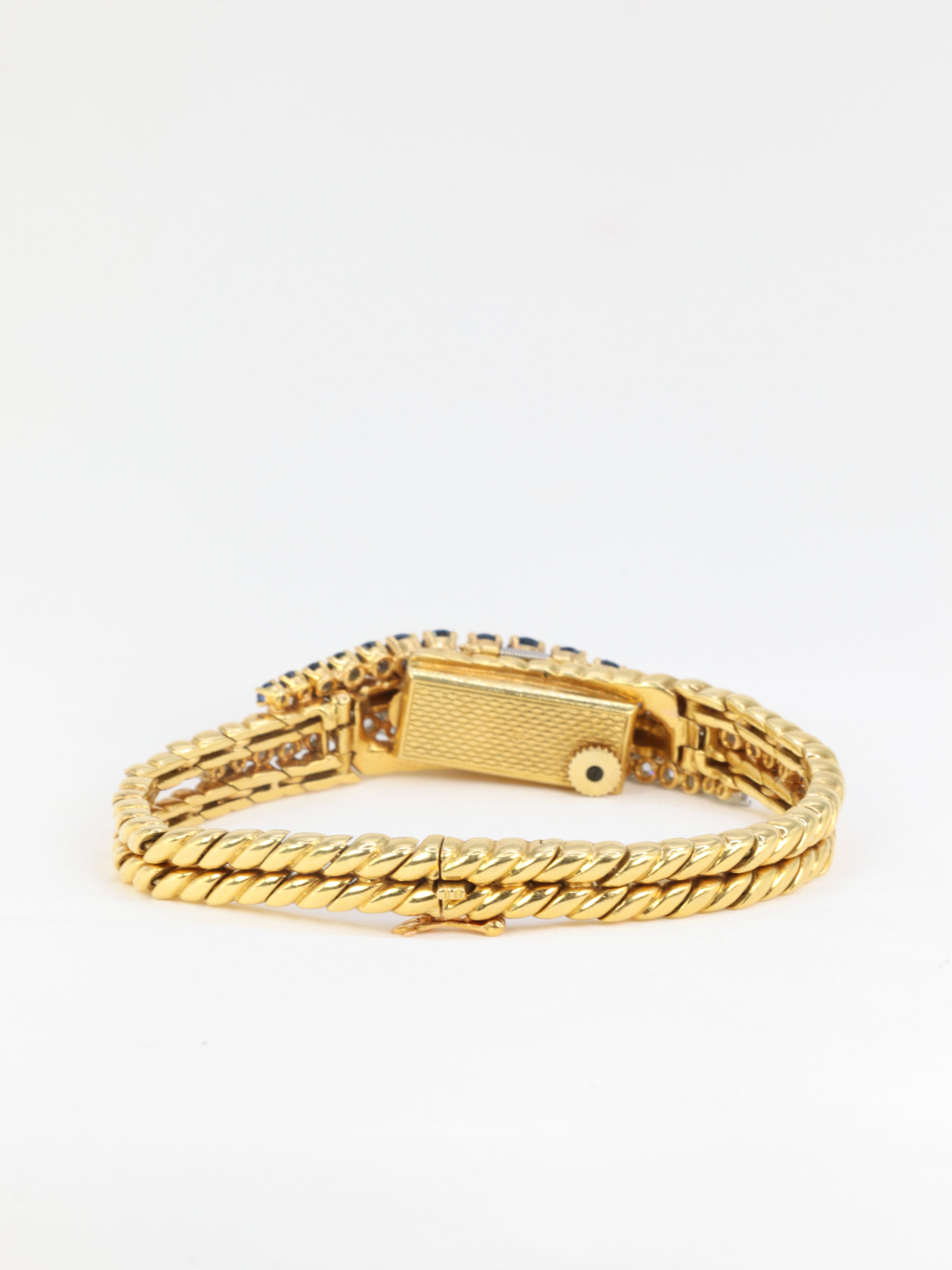 BOUCHERON Montre à secret or platine saphirs diamants