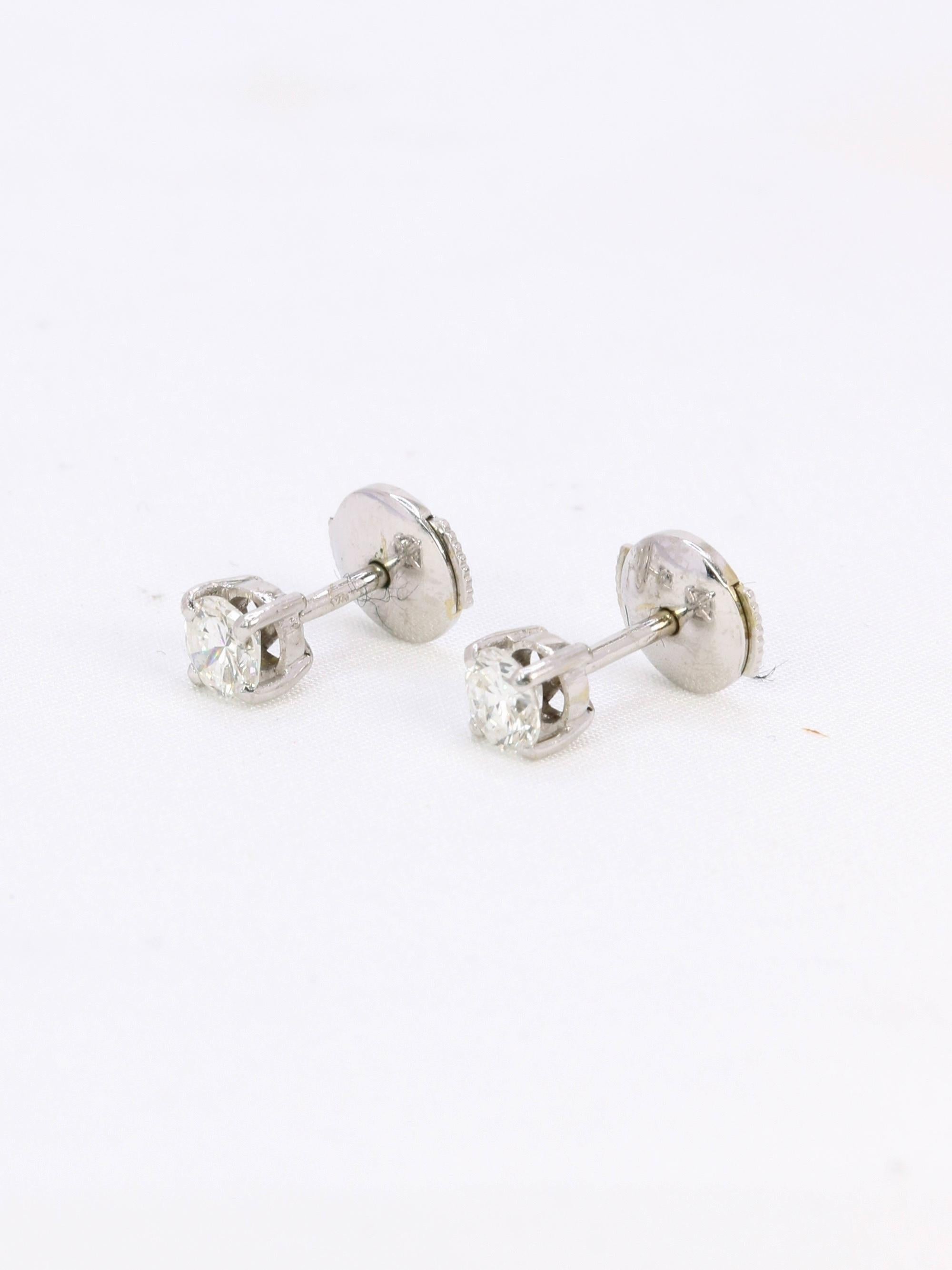 Puces d'oreilles or blanc diamants ronds 0.7 carat