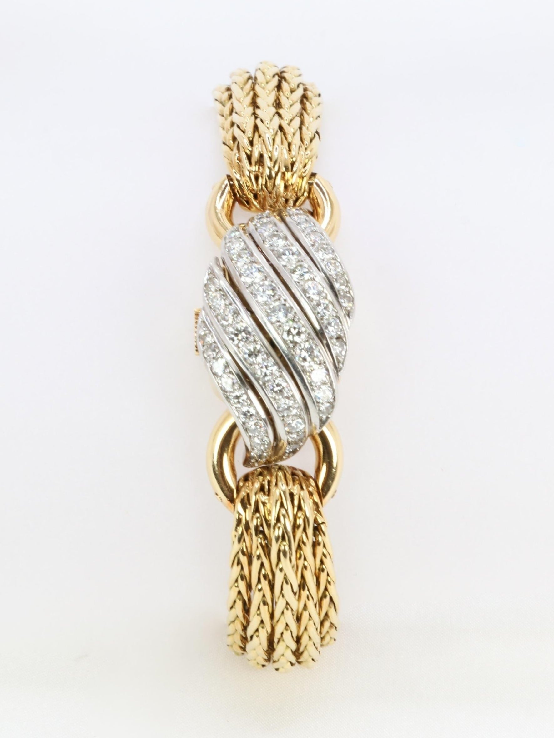 BOUCHERON Montre à secrets or jaune diamants
