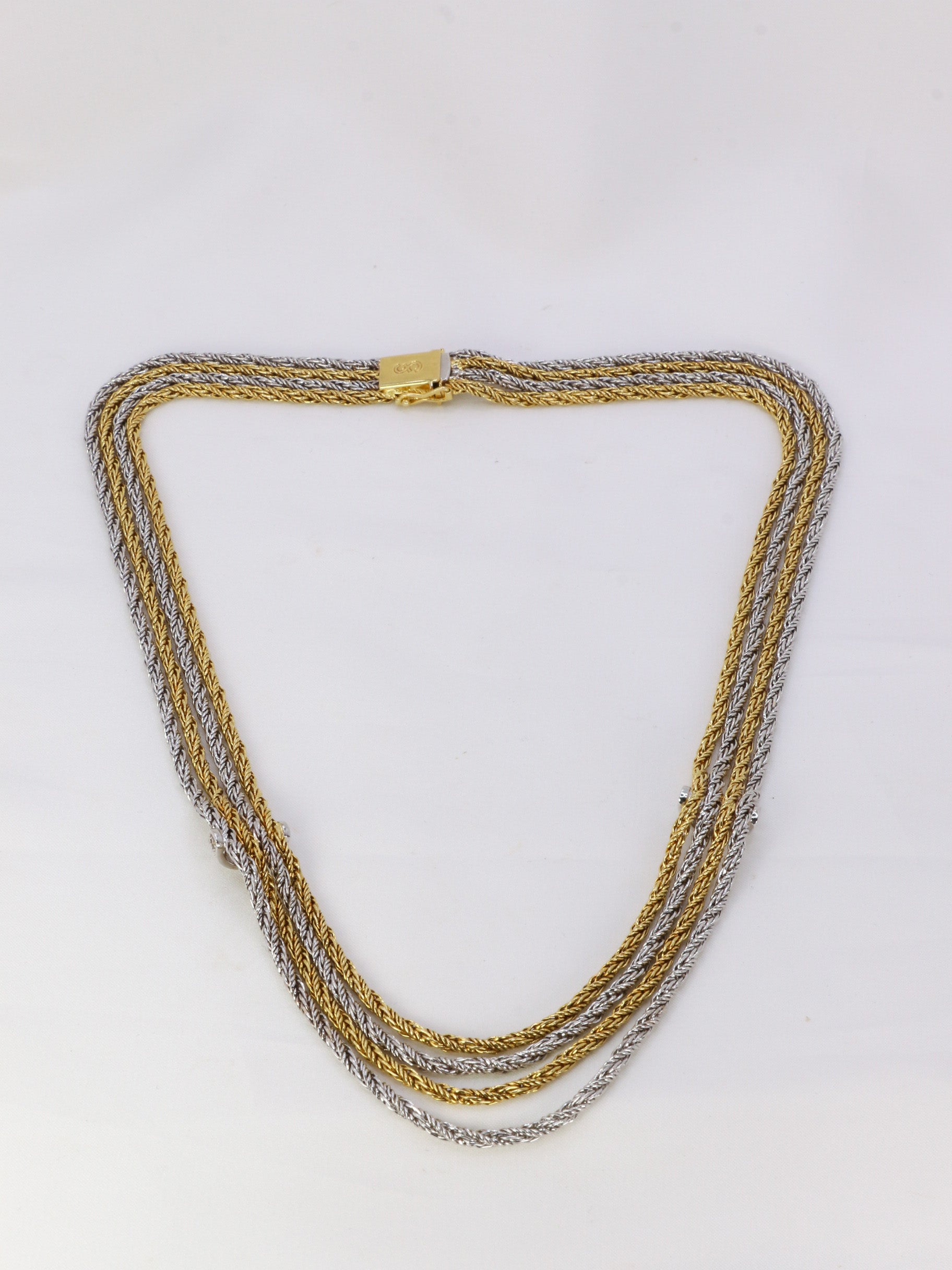 Vintage four-row drapery necklace in gold and diamonds