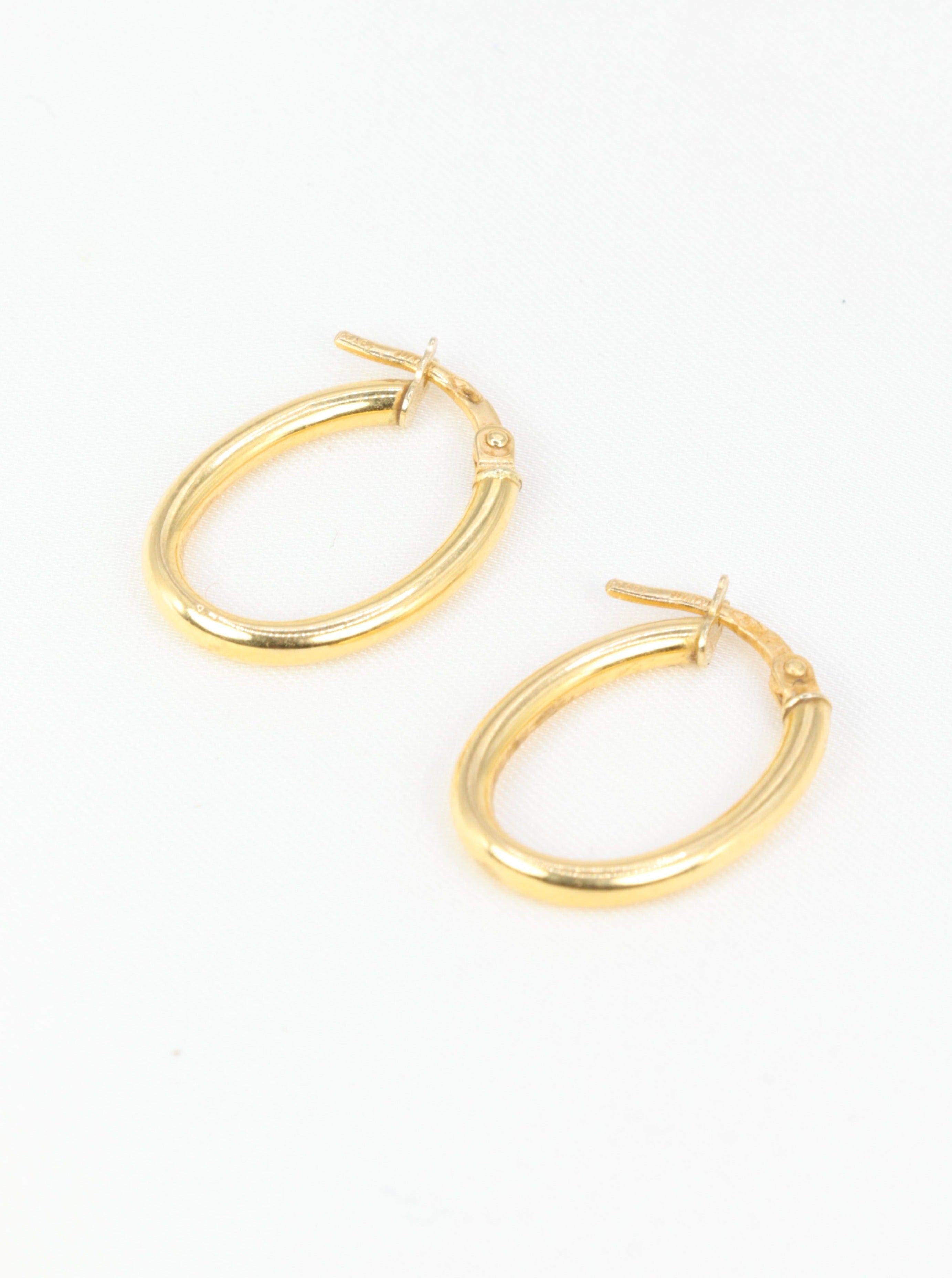 Pair of vintage oval hoop earrings in yellow gold