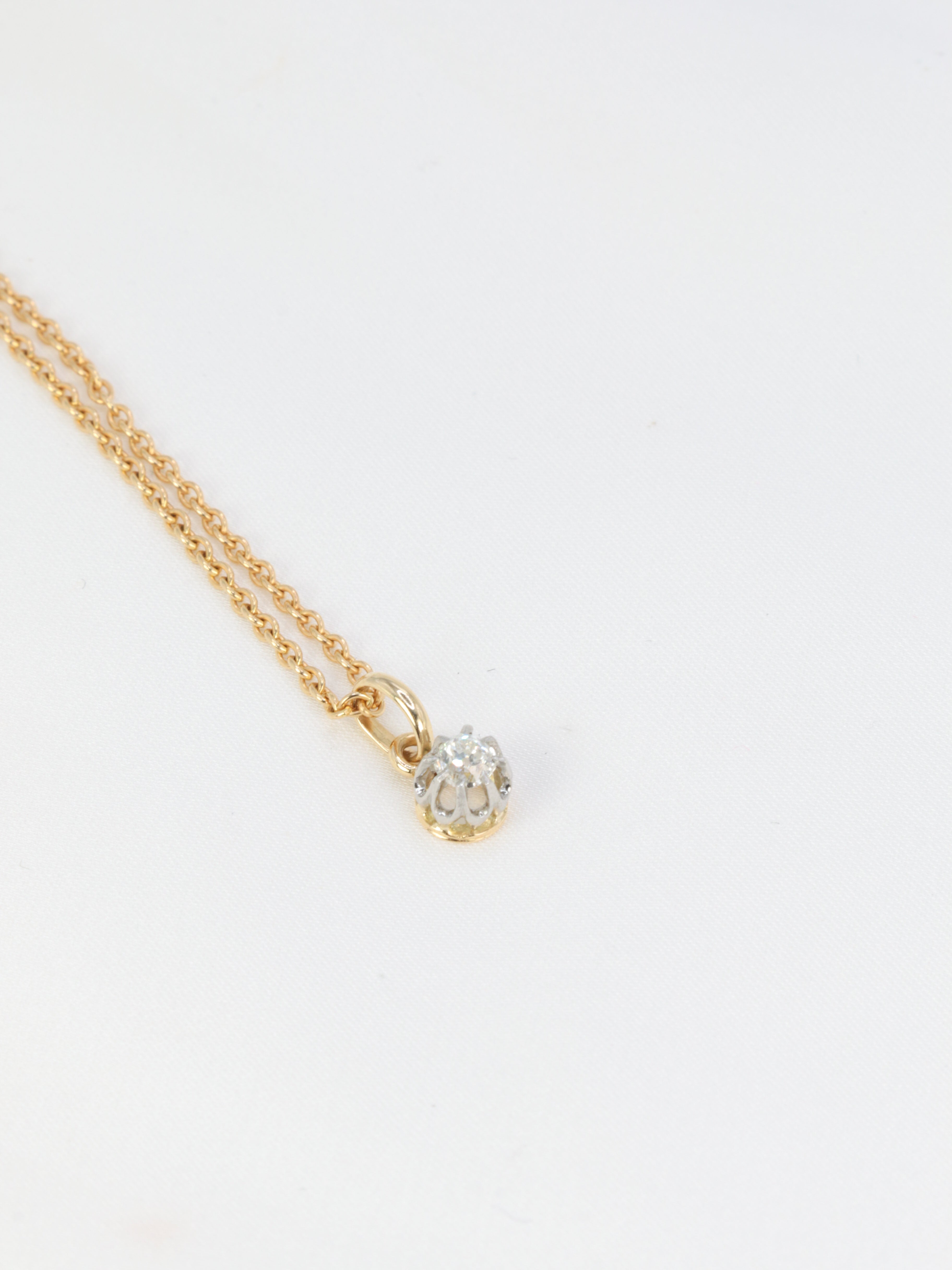 Antique solitaire pendant in gold, silver and old cut diamond 0.2 ct