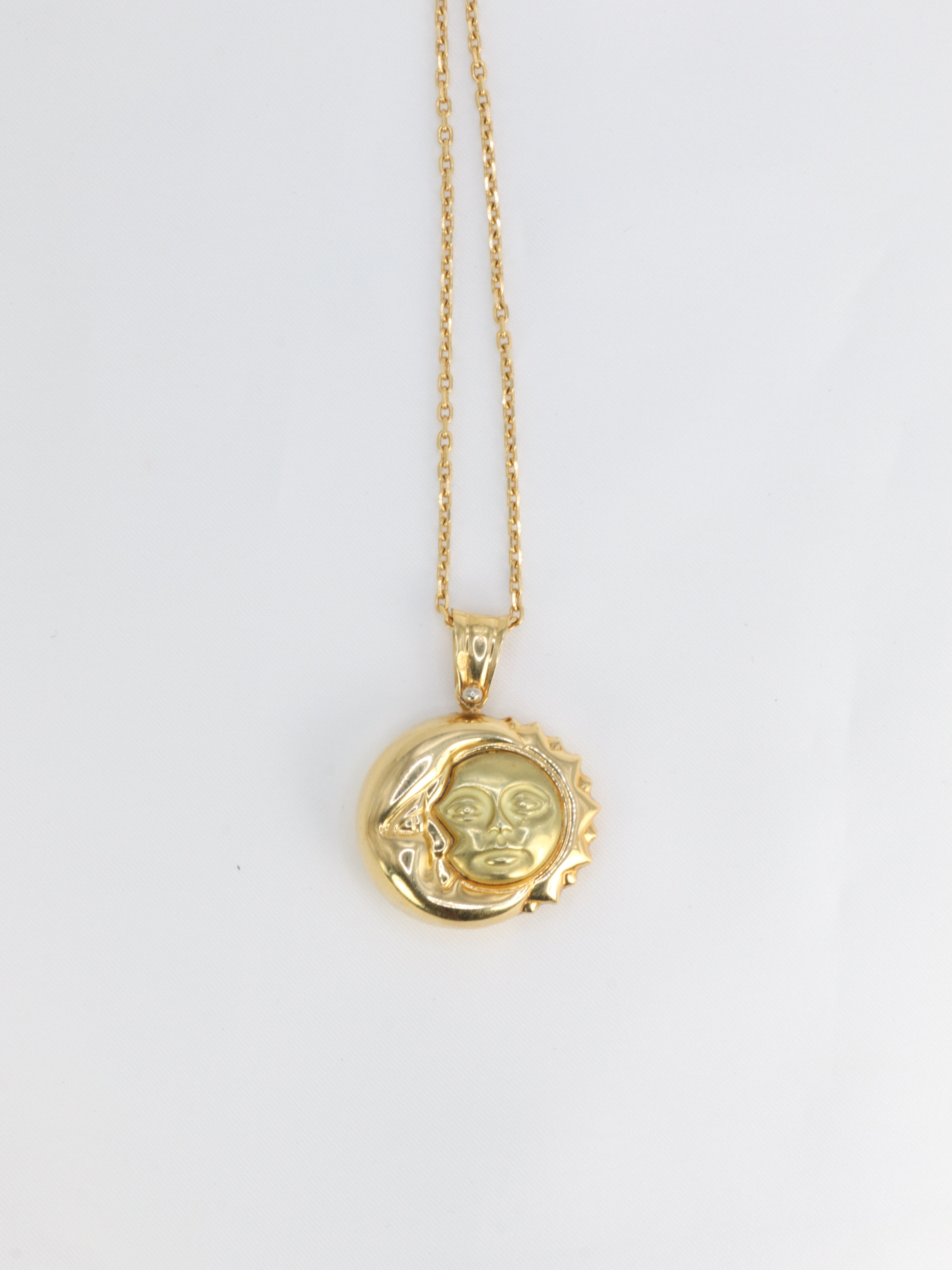 Vintage astral Moon and Sun pendant in yellow gold