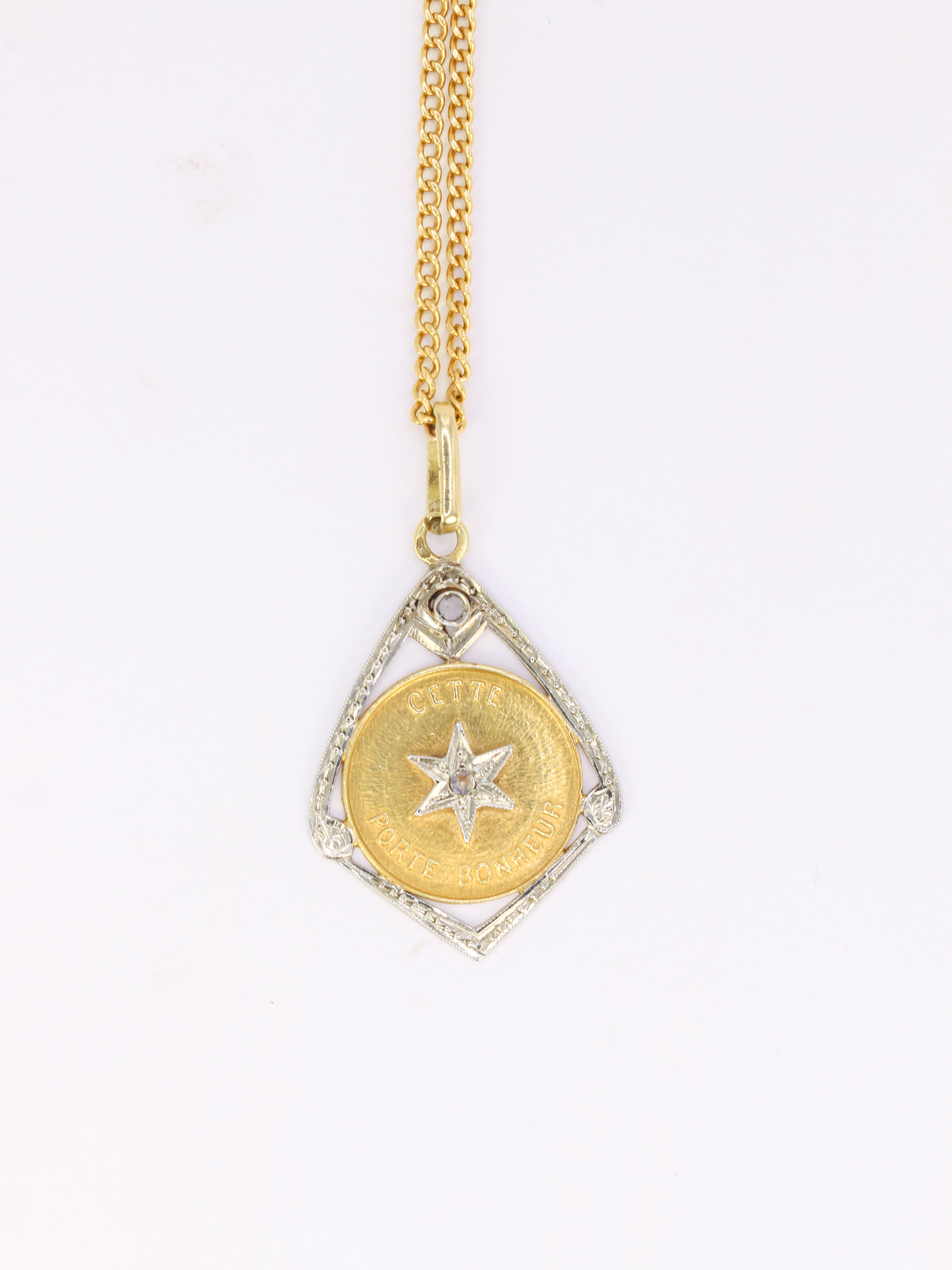 Vintage “Ce Toile Porte Bonheur” pendant in gold and diamonds