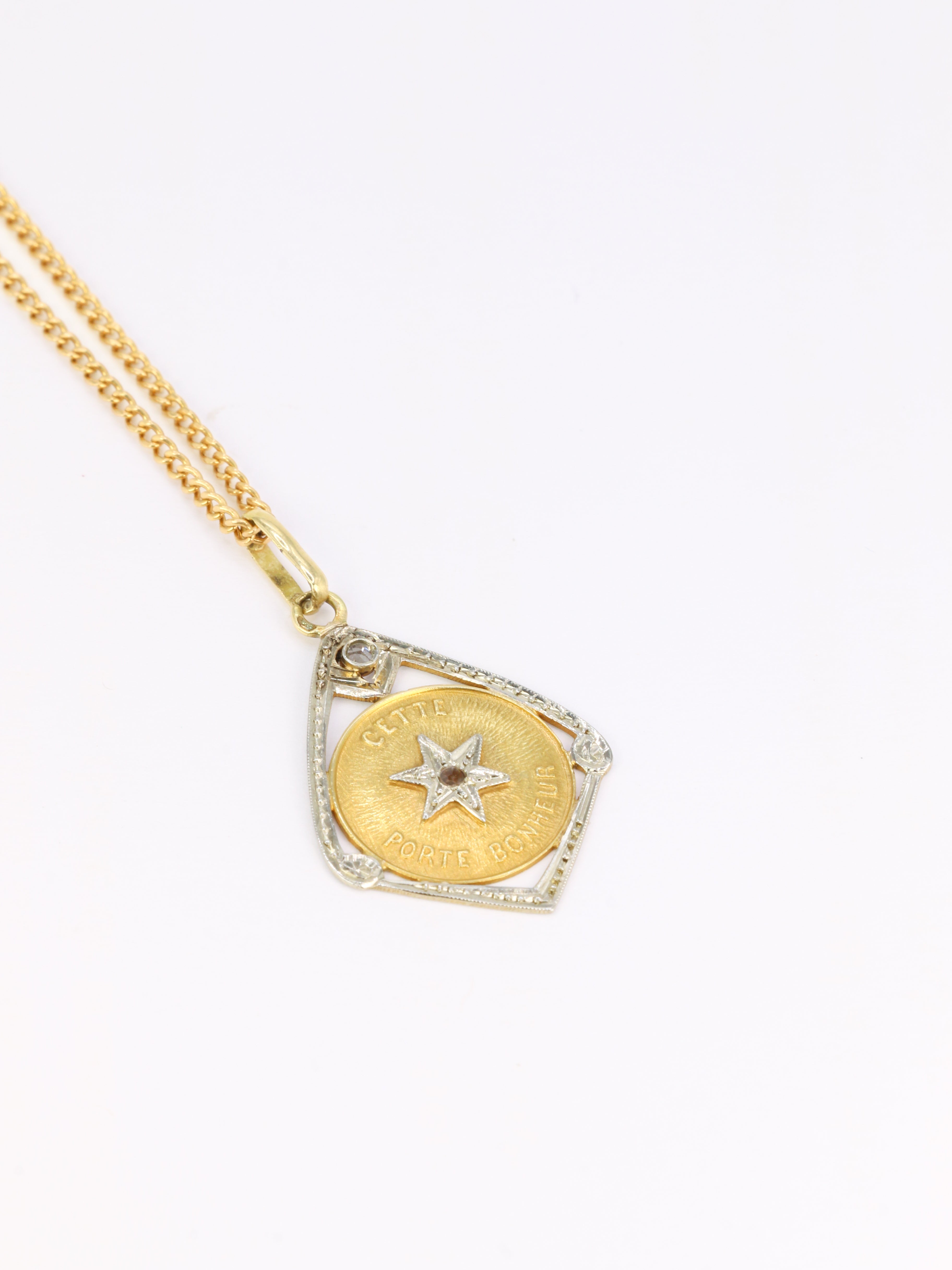 Vintage “Ce Toile Porte Bonheur” pendant in gold and diamonds