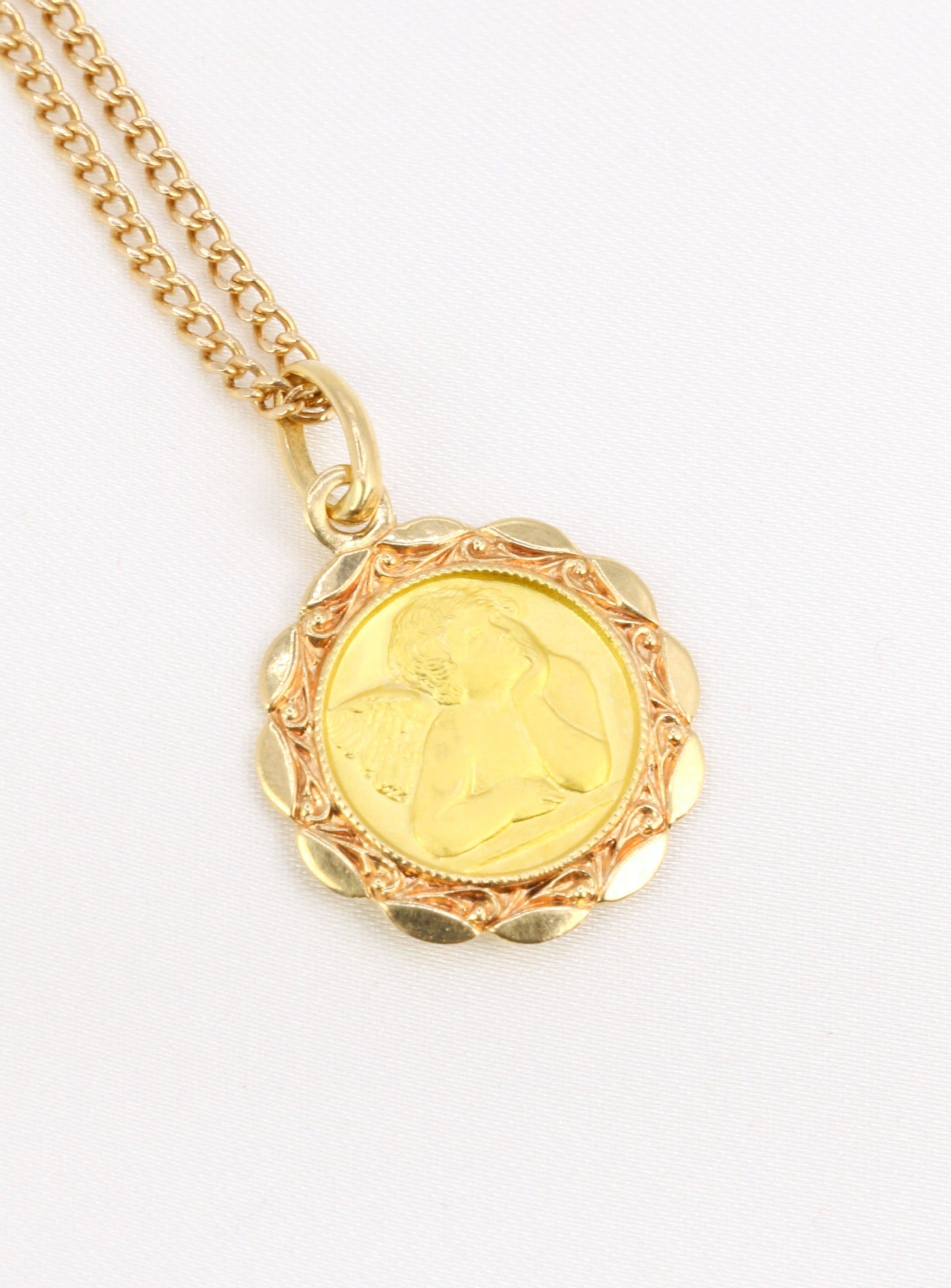 Vintage religious medal in yellow gold depicting an angel