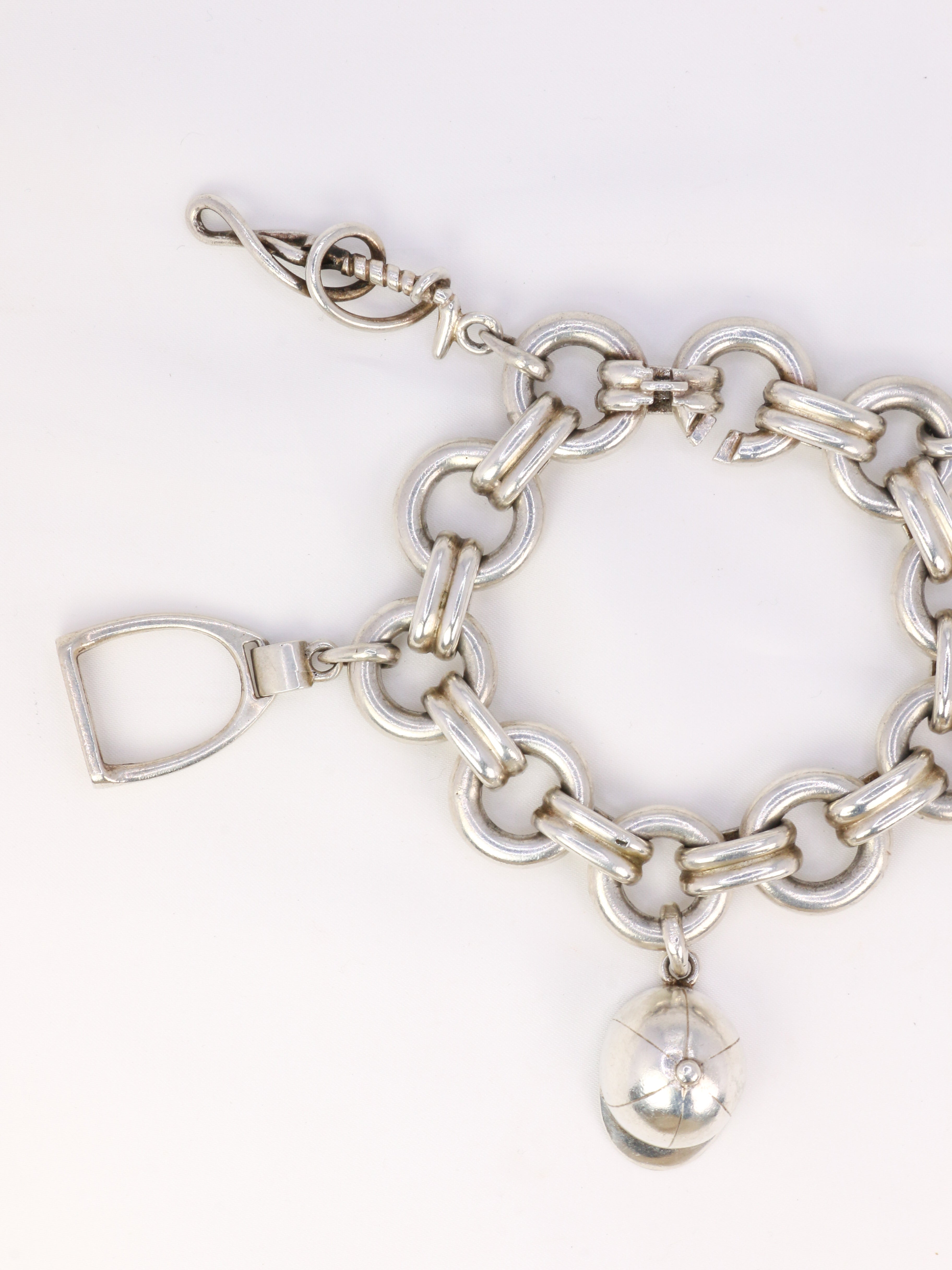 Gaétan de Percin (attributed to HERMES) Silver bracelet and horse-racing theme charms