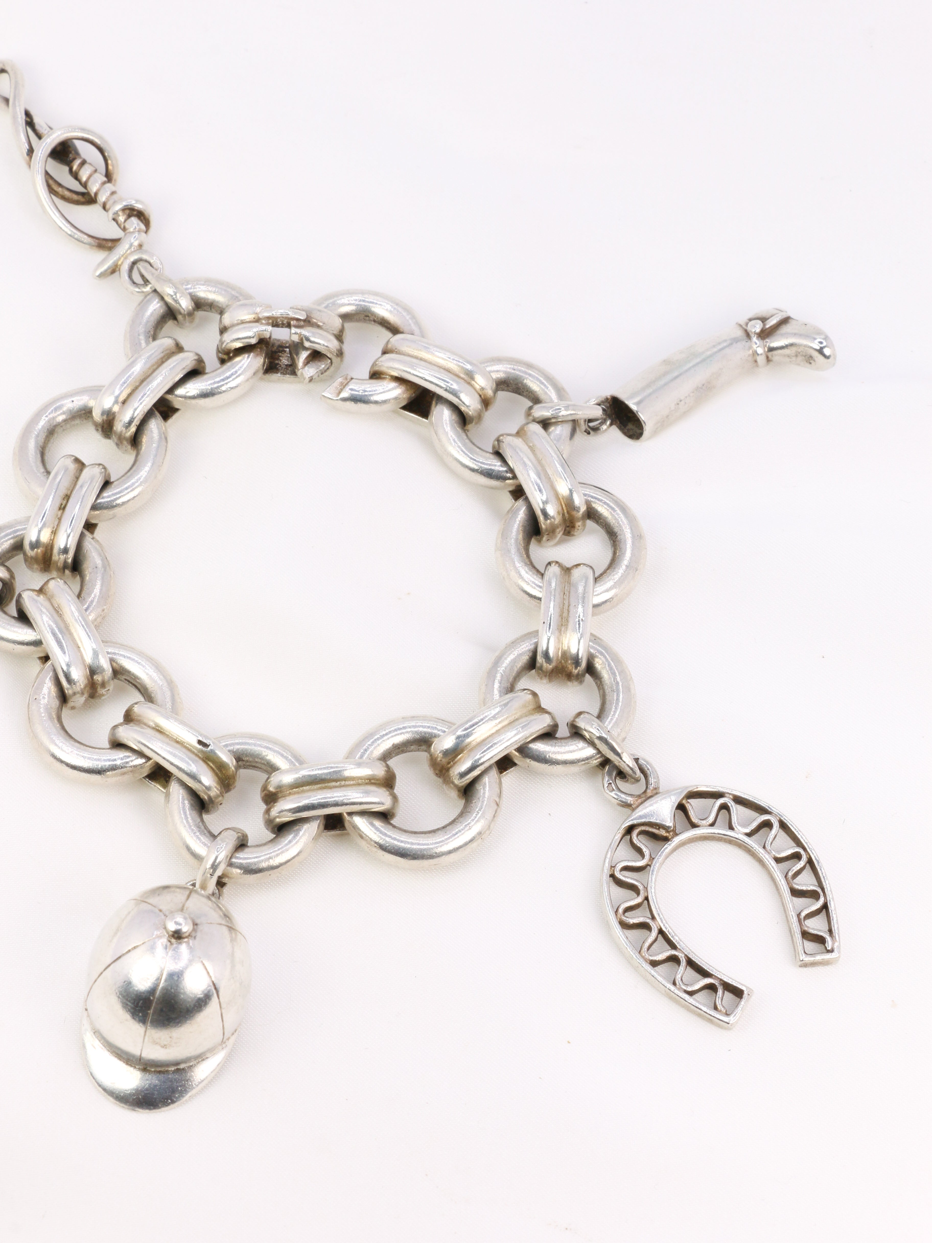 Gaétan de Percin (attributed to HERMES) Silver bracelet and horse-racing theme charms