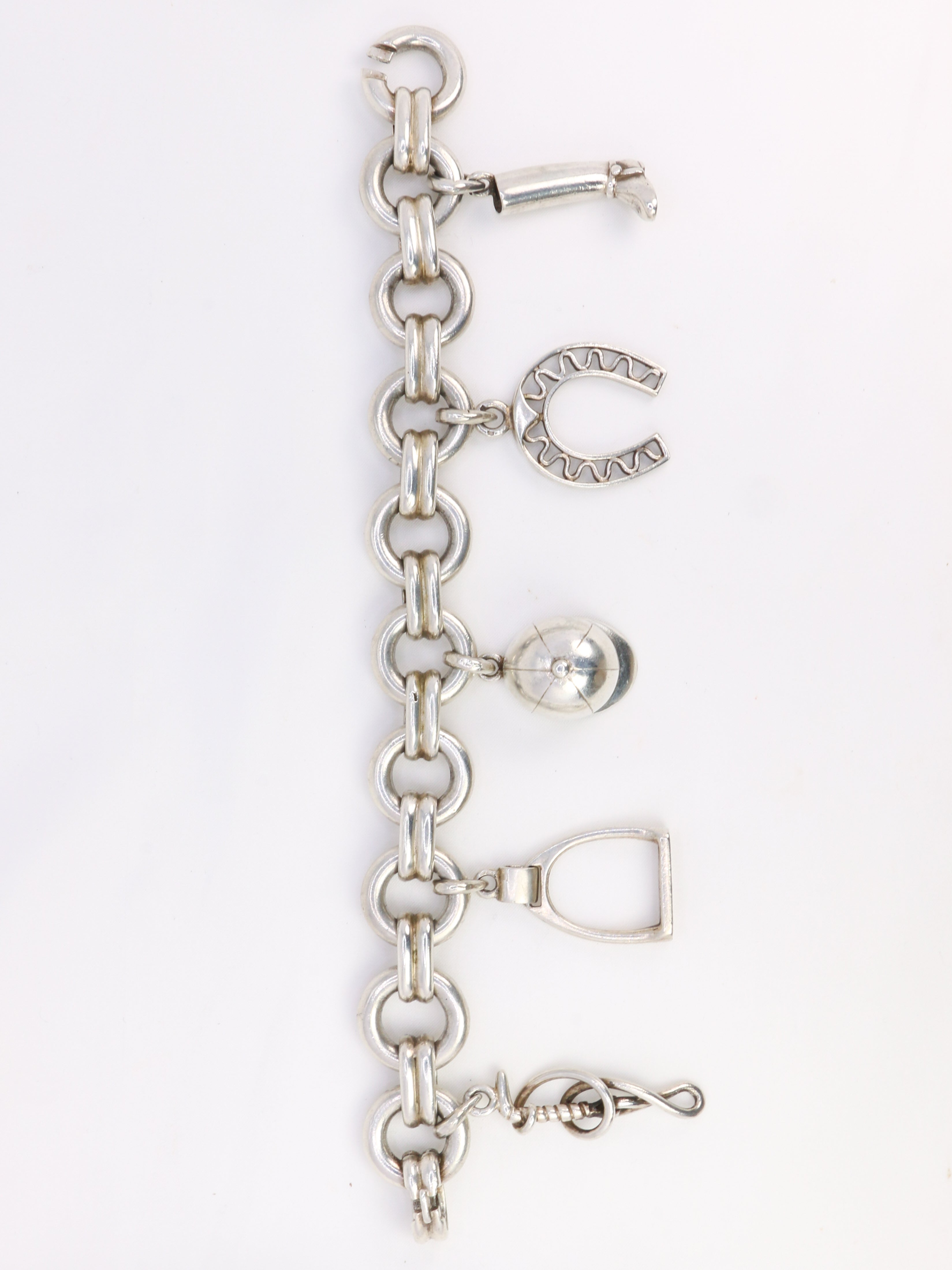 Gaétan de Percin (attributed to HERMES) Silver bracelet and horse-racing theme charms