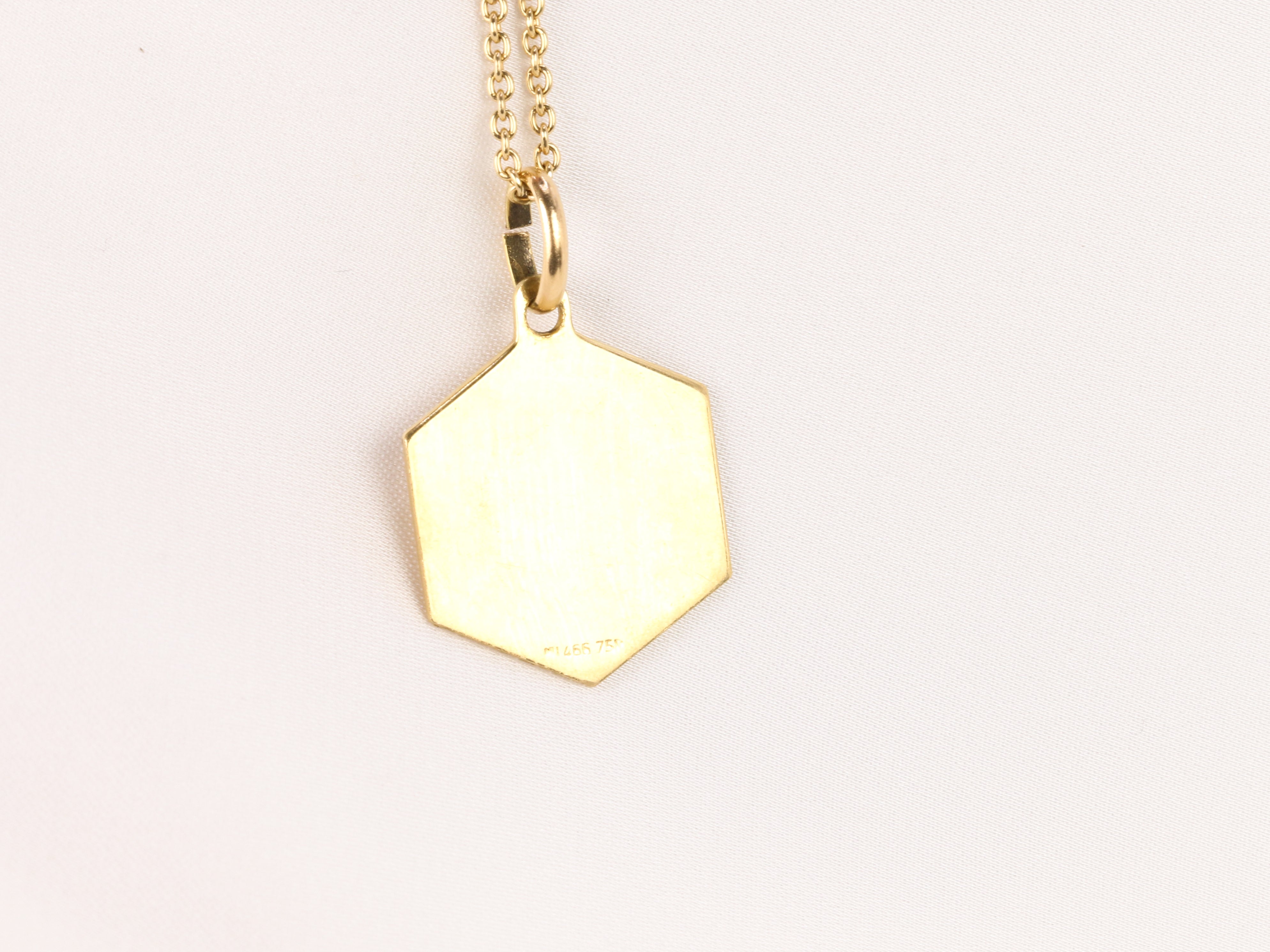 Vintage yellow gold medal featuring the zodiac sign of Leo