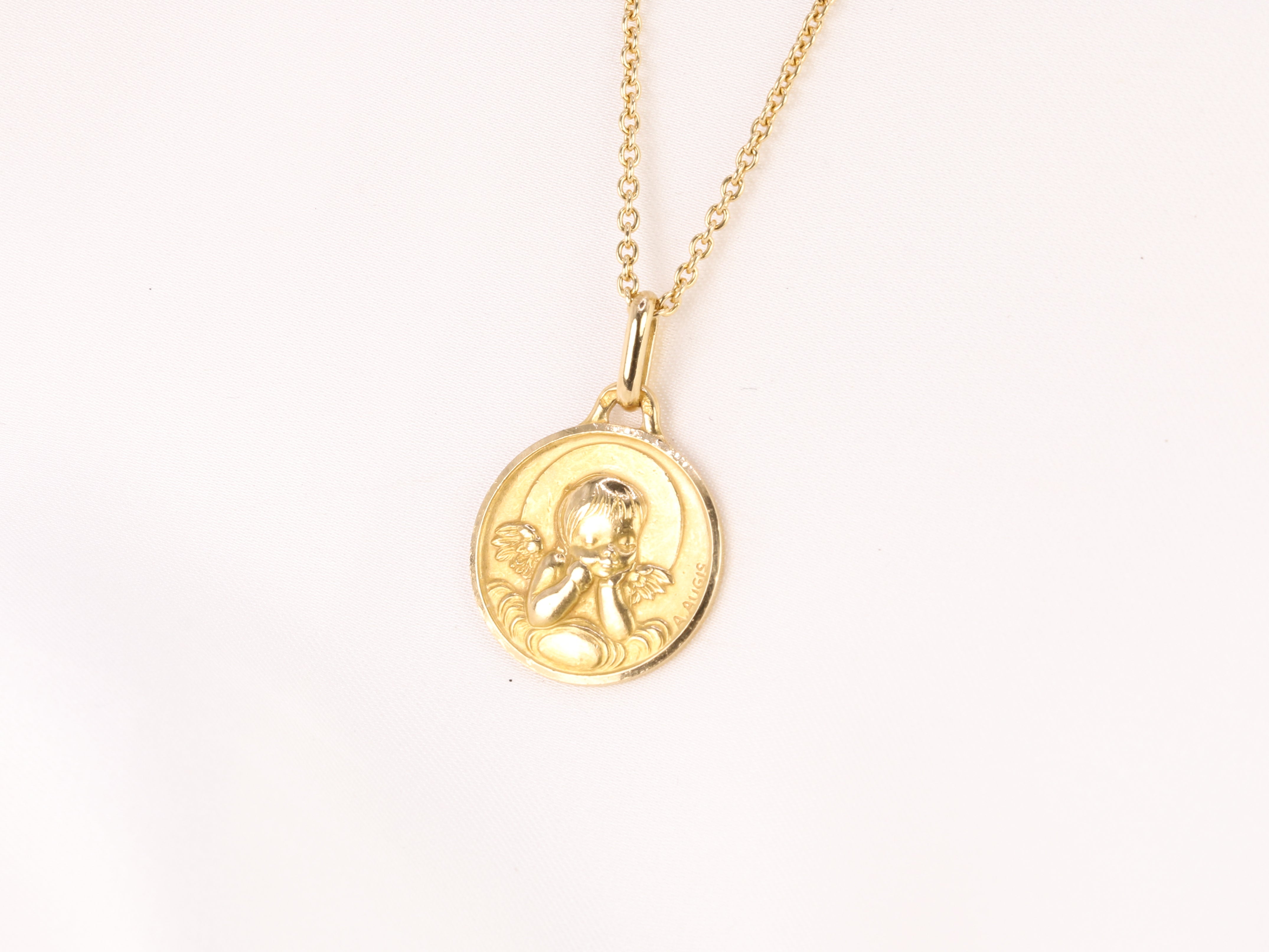 Vintage Augis medal in yellow gold depicting an angel with a quiver