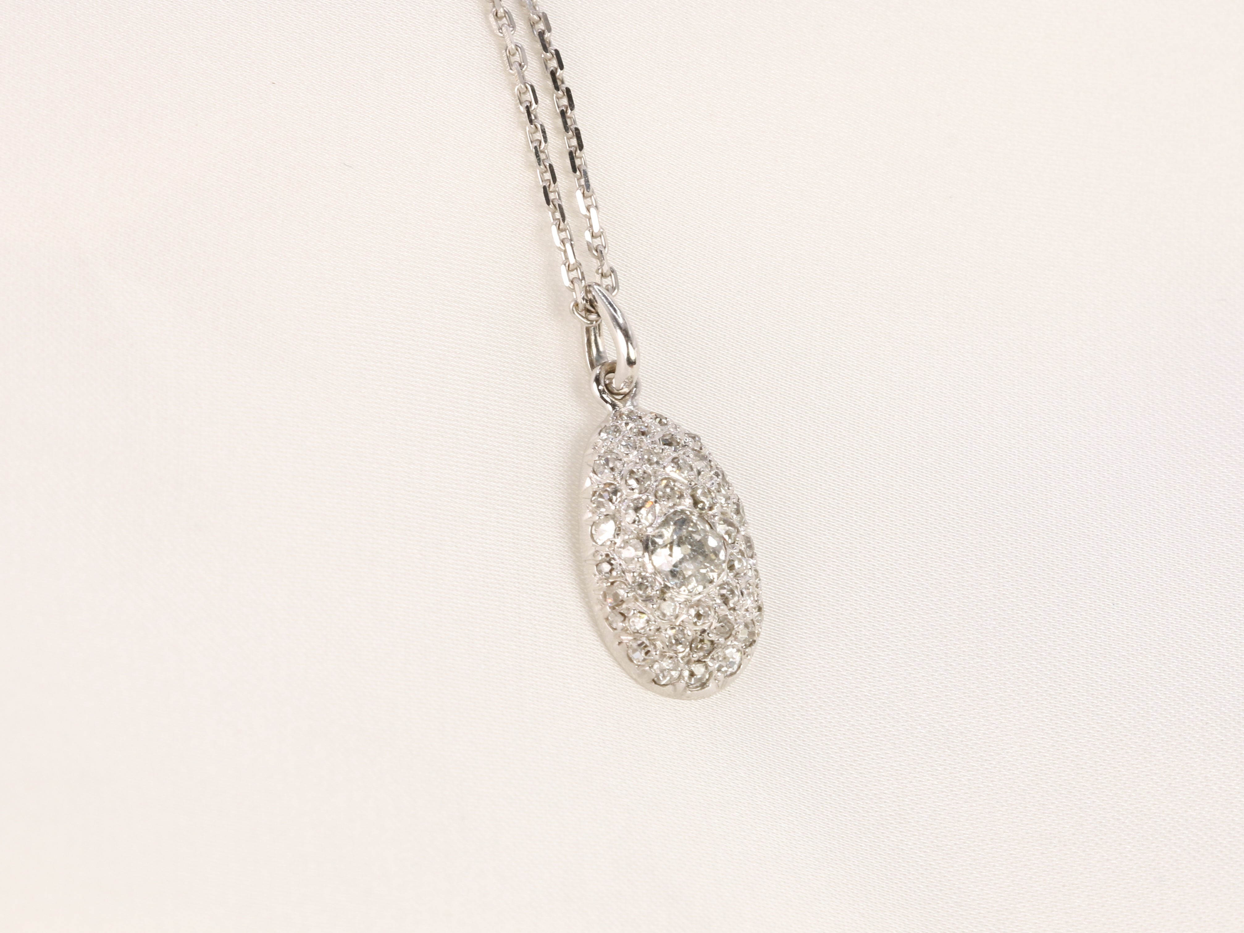 Old ovoid pendant in white gold and old cut diamonds 