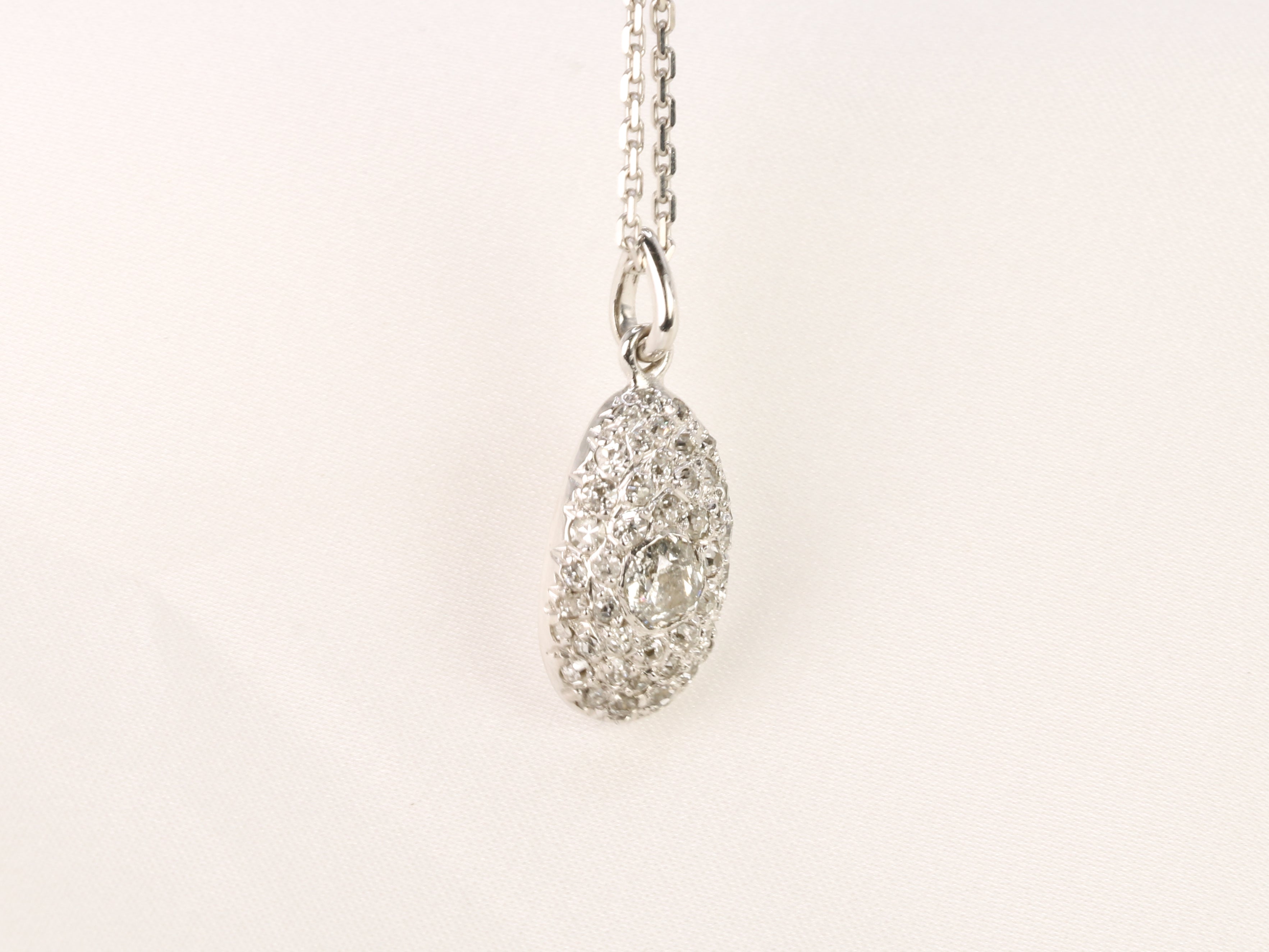 Old ovoid pendant in white gold and old cut diamonds 