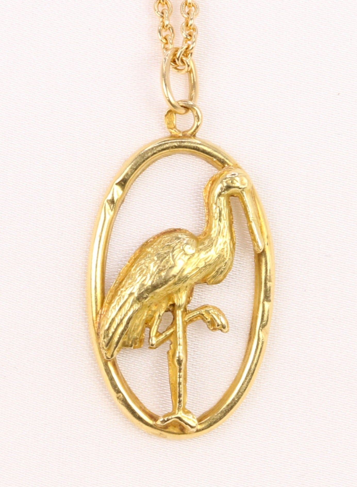 Yellow gold pendant depicting a stork