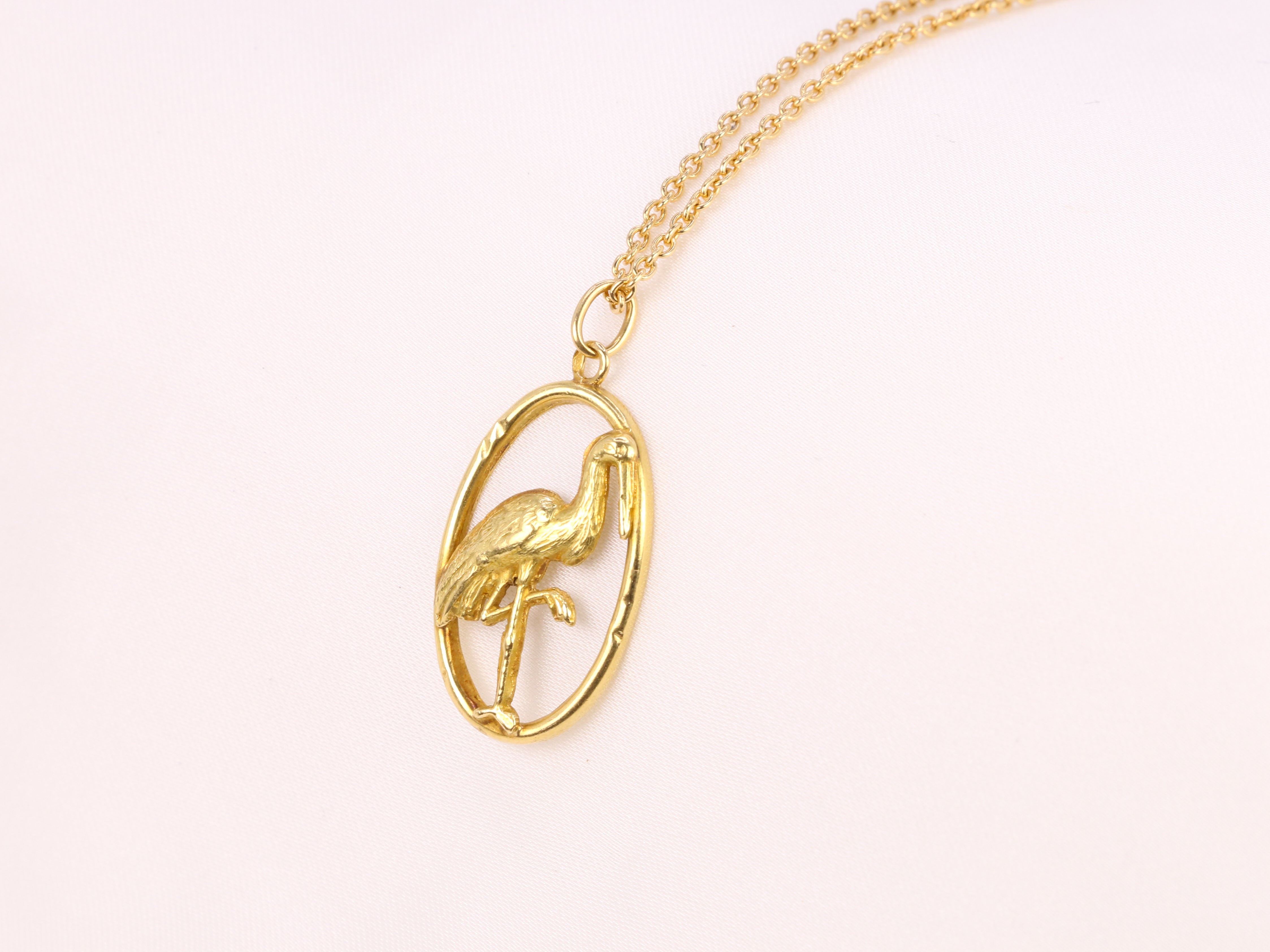 Yellow gold pendant depicting a stork