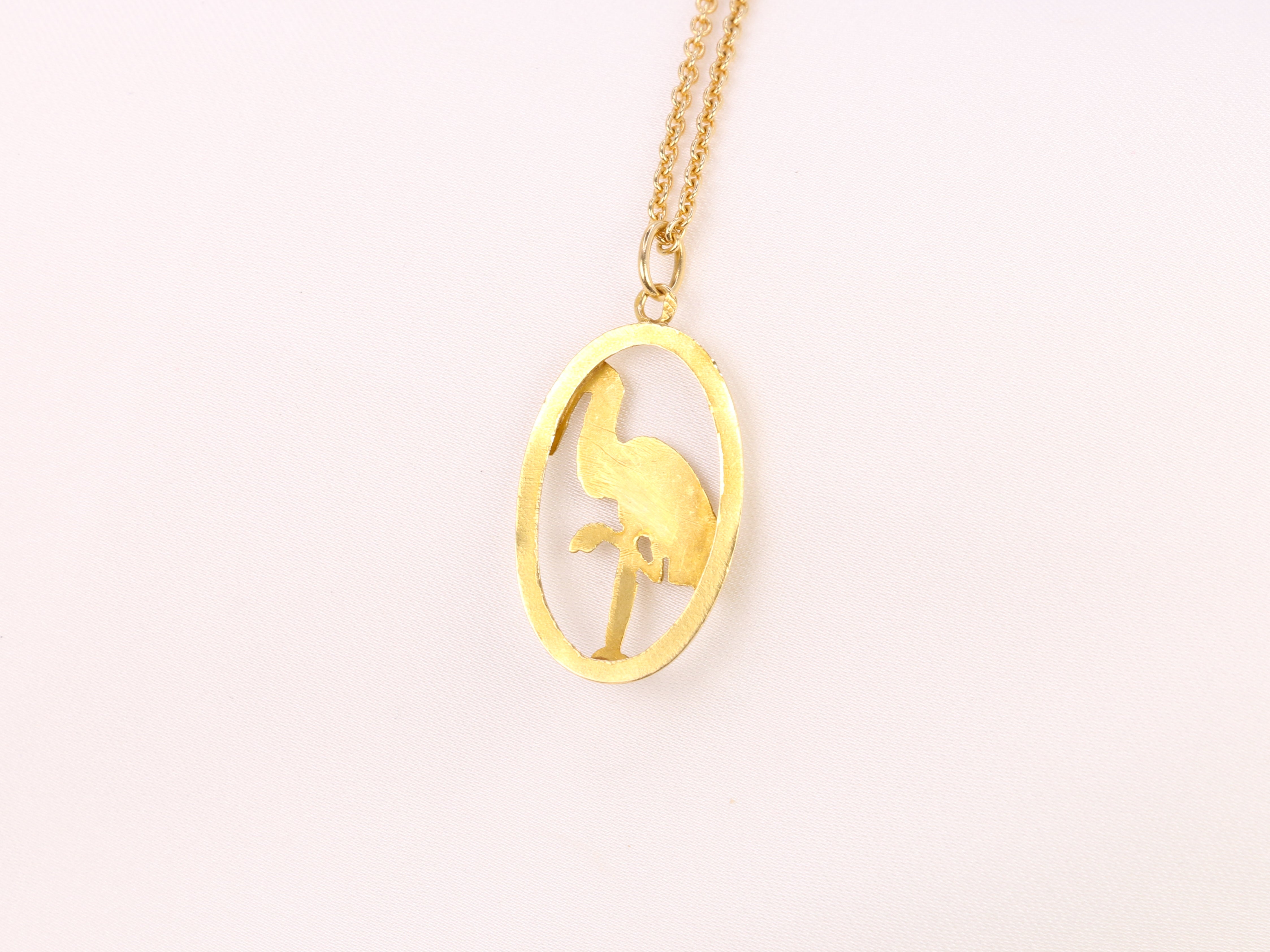 Yellow gold pendant depicting a stork