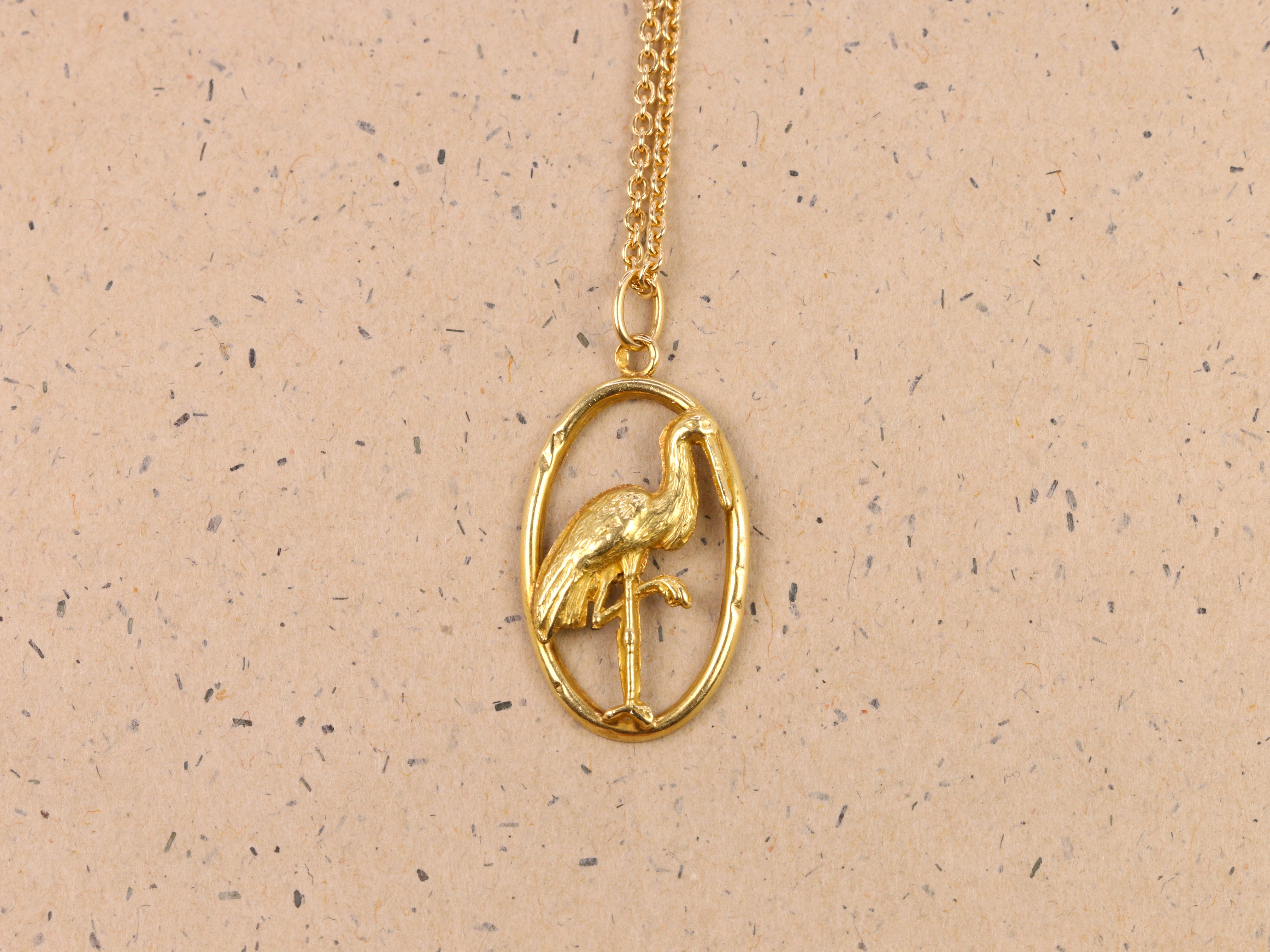 Yellow gold pendant depicting a stork